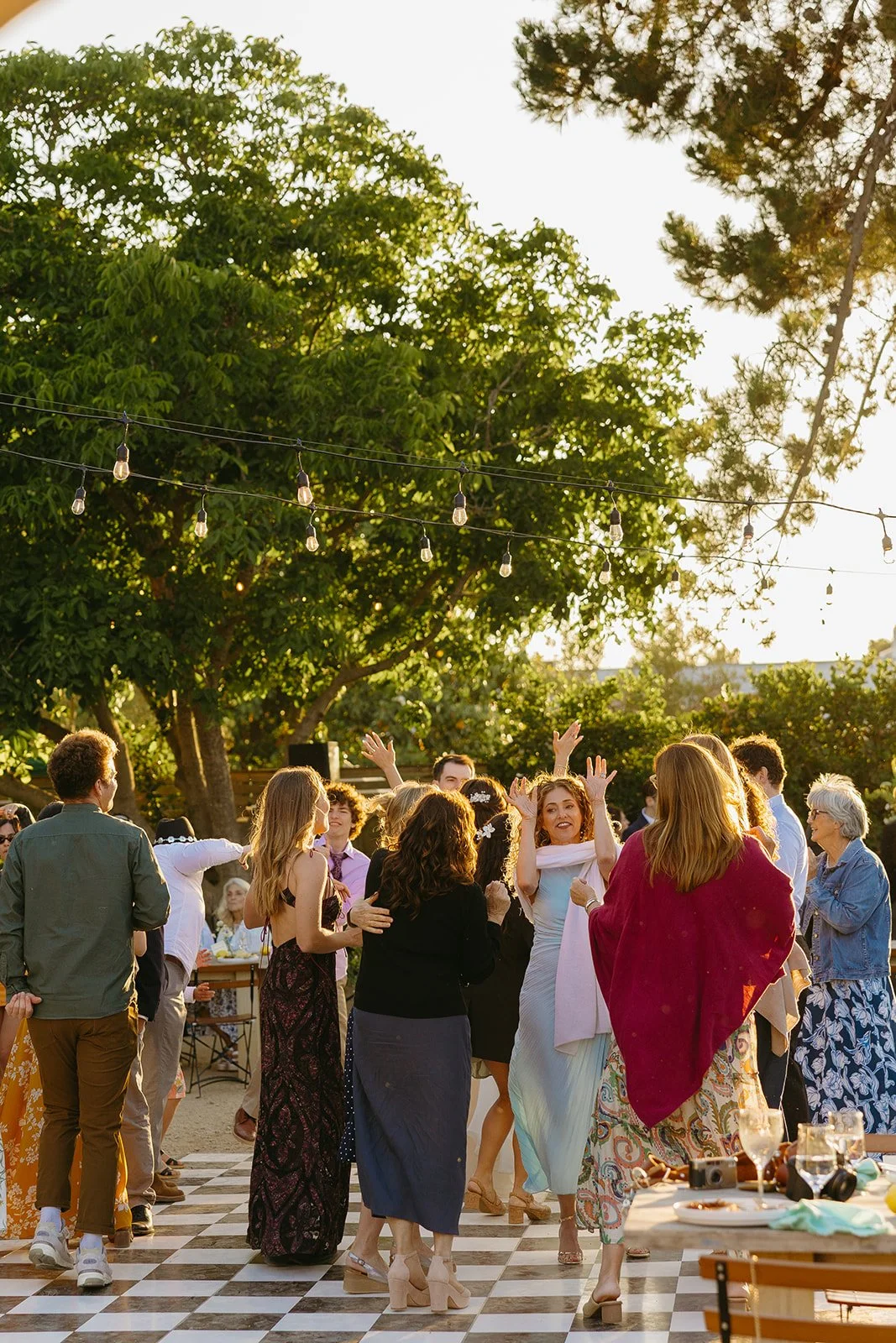 Wedding guests at an outdoor wedding showing off small wedding ideas