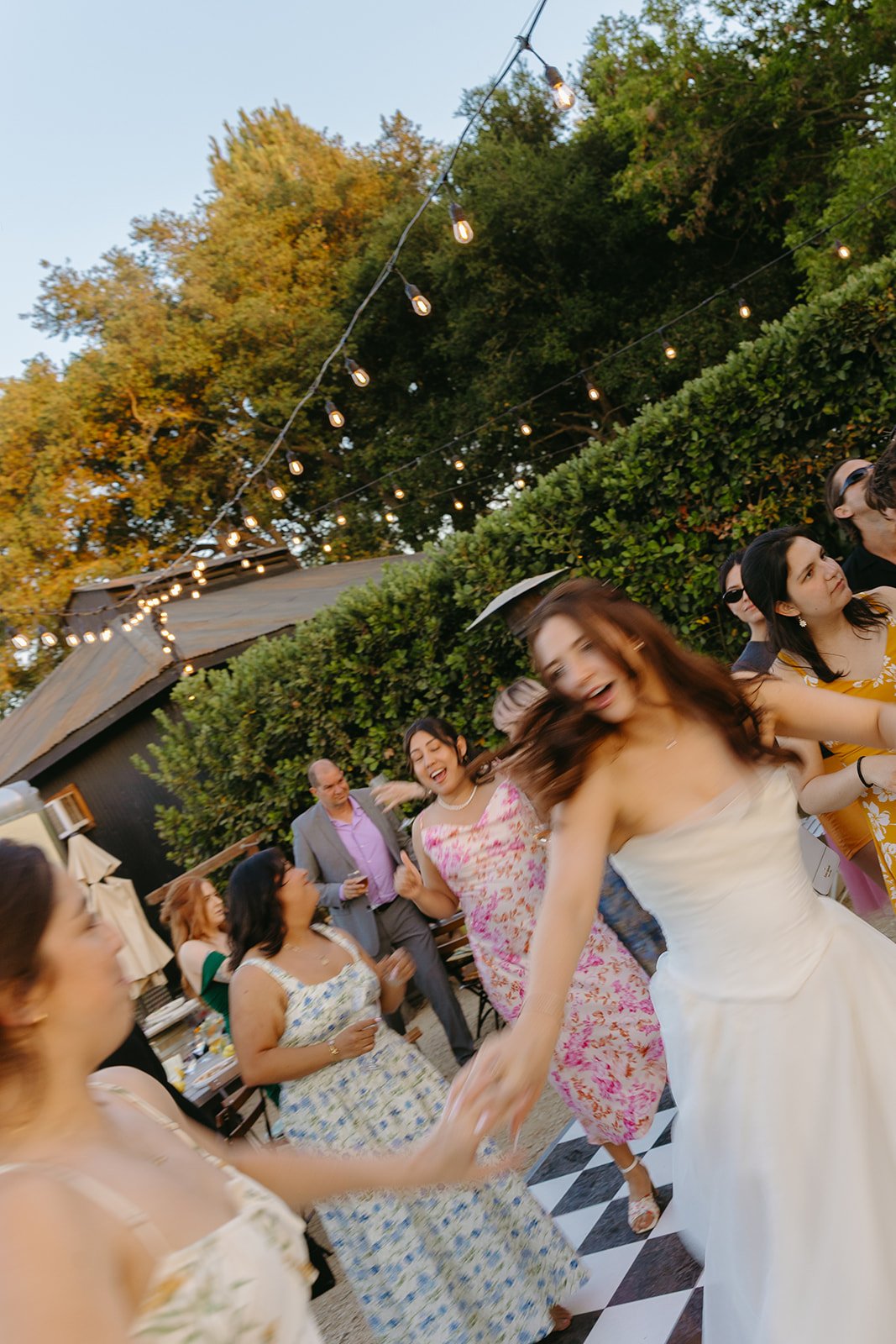 Wedding guests at an outdoor wedding showing off small wedding ideas