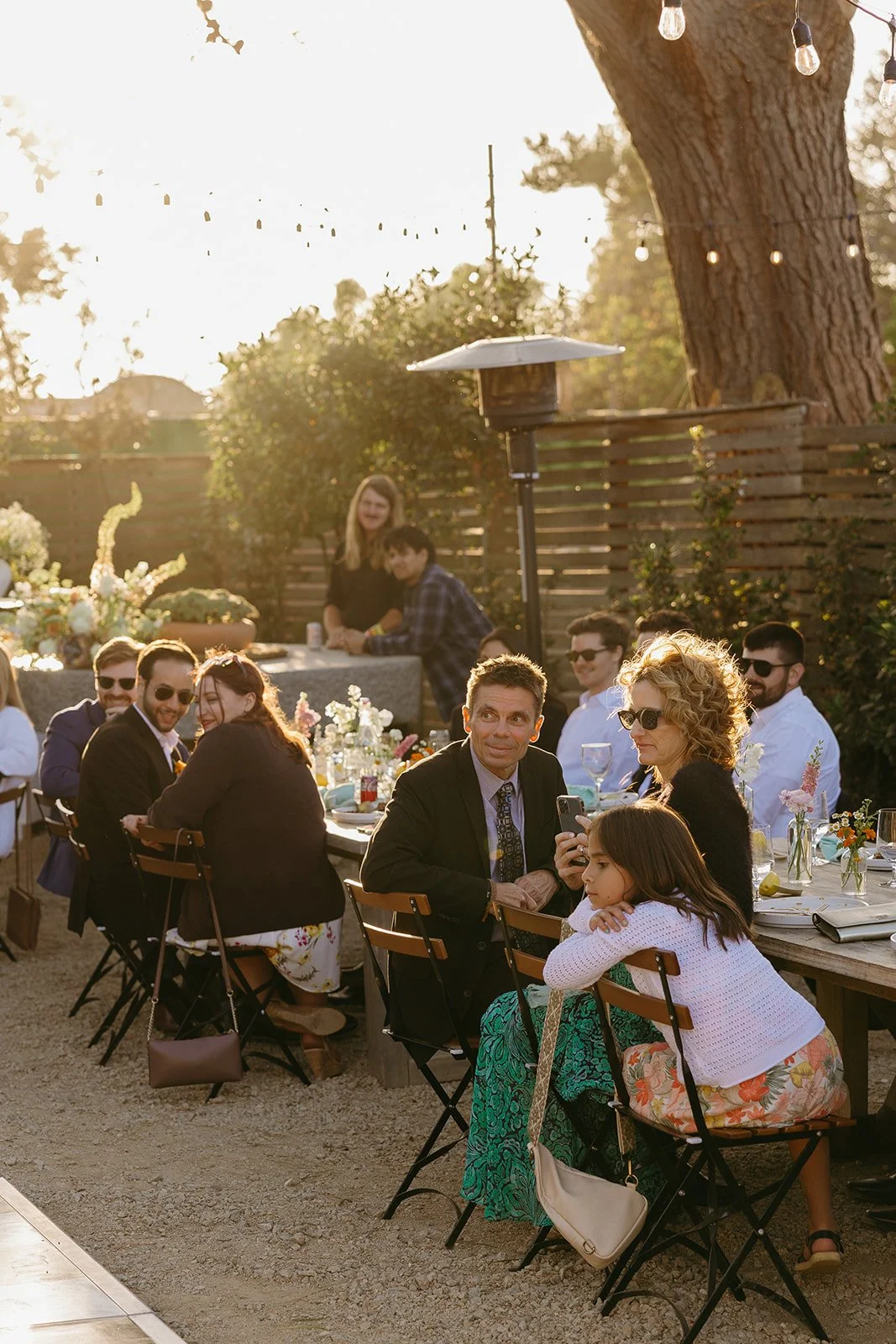 Wedding guests watching wedding toasts