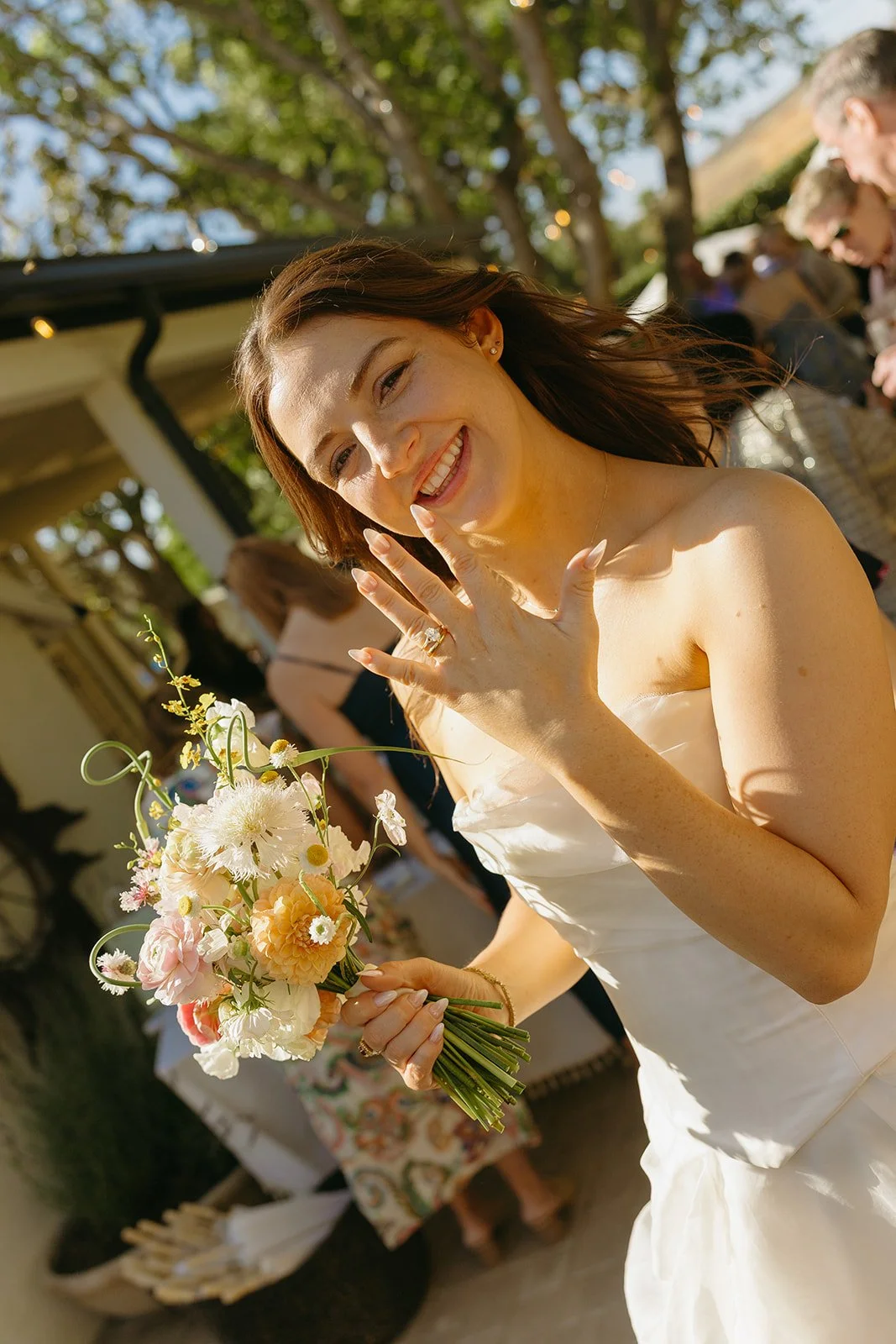 A bride showing off her wedding ring after her small wedding ceremony