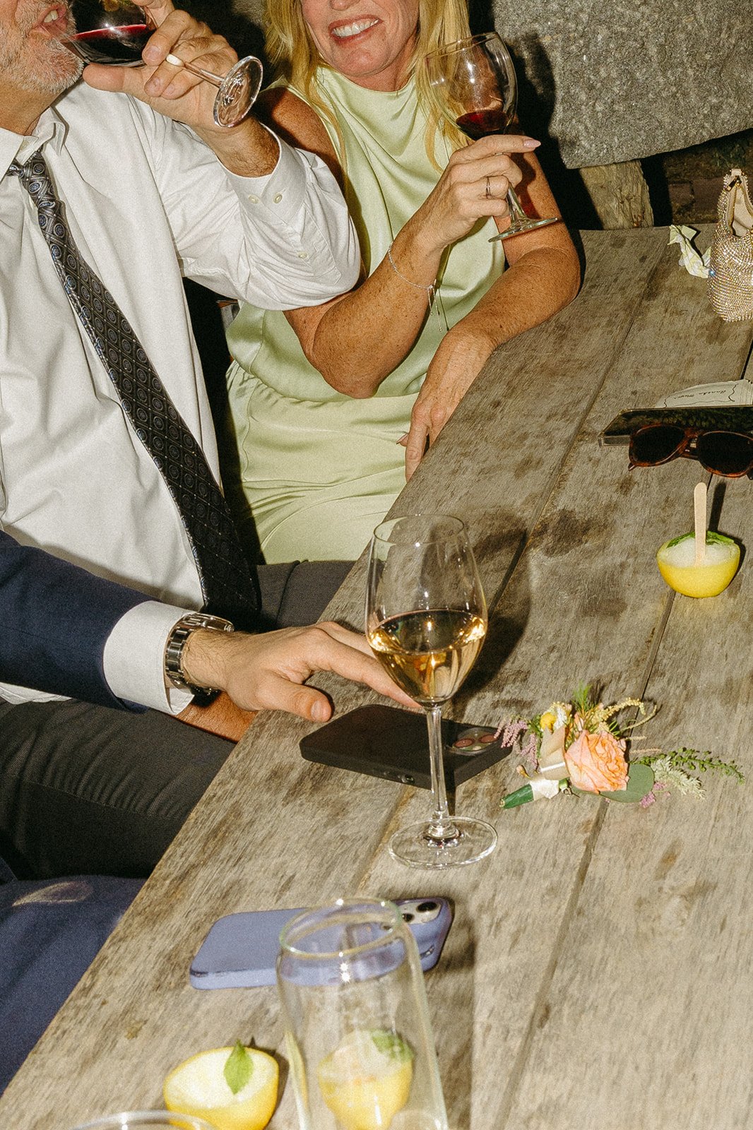 Wedding guests enjoying wine and wedding desserts