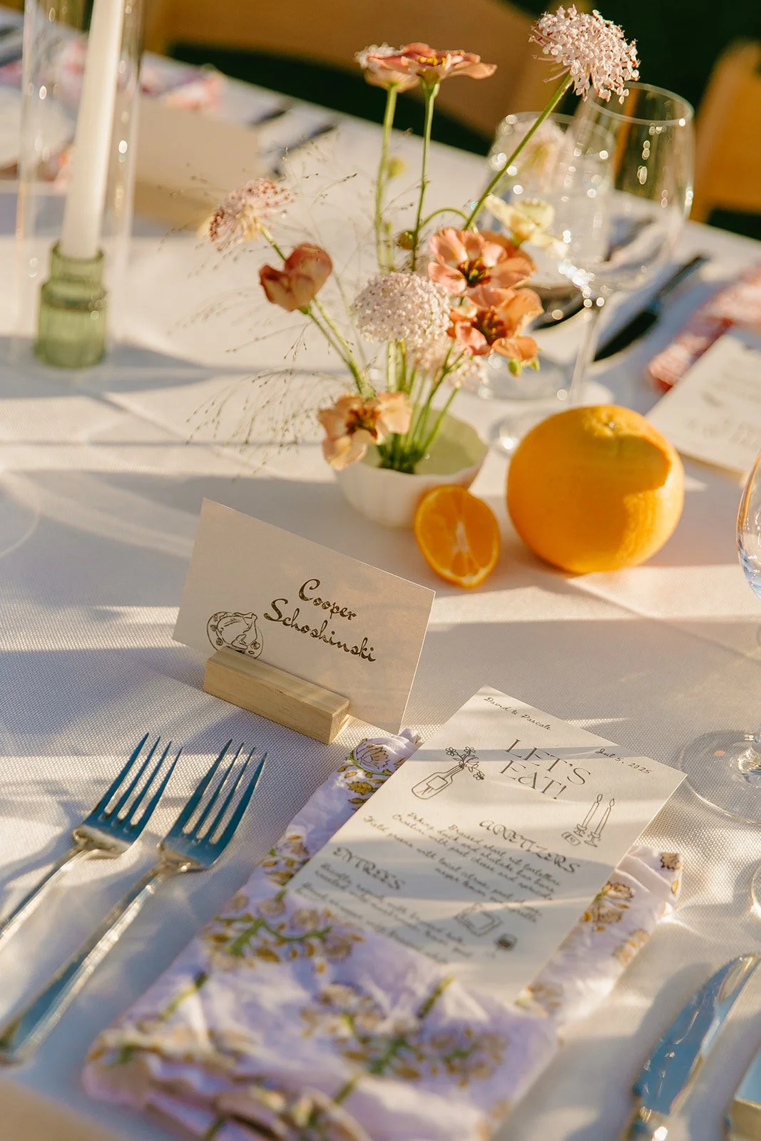 A wedding tablescape with fresh fruit centerpieces