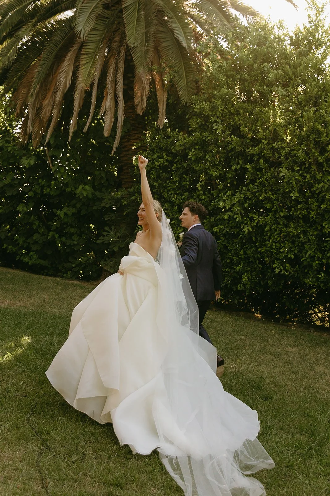 A bride and groom exiting their wedding ceremony