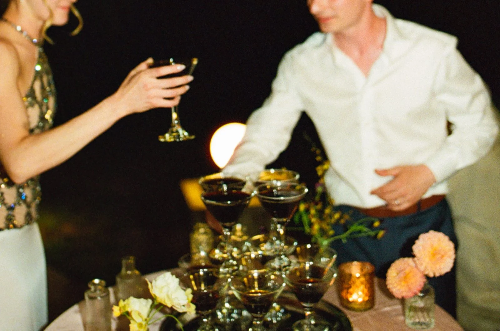 A bride and groom at their wedding martini tower