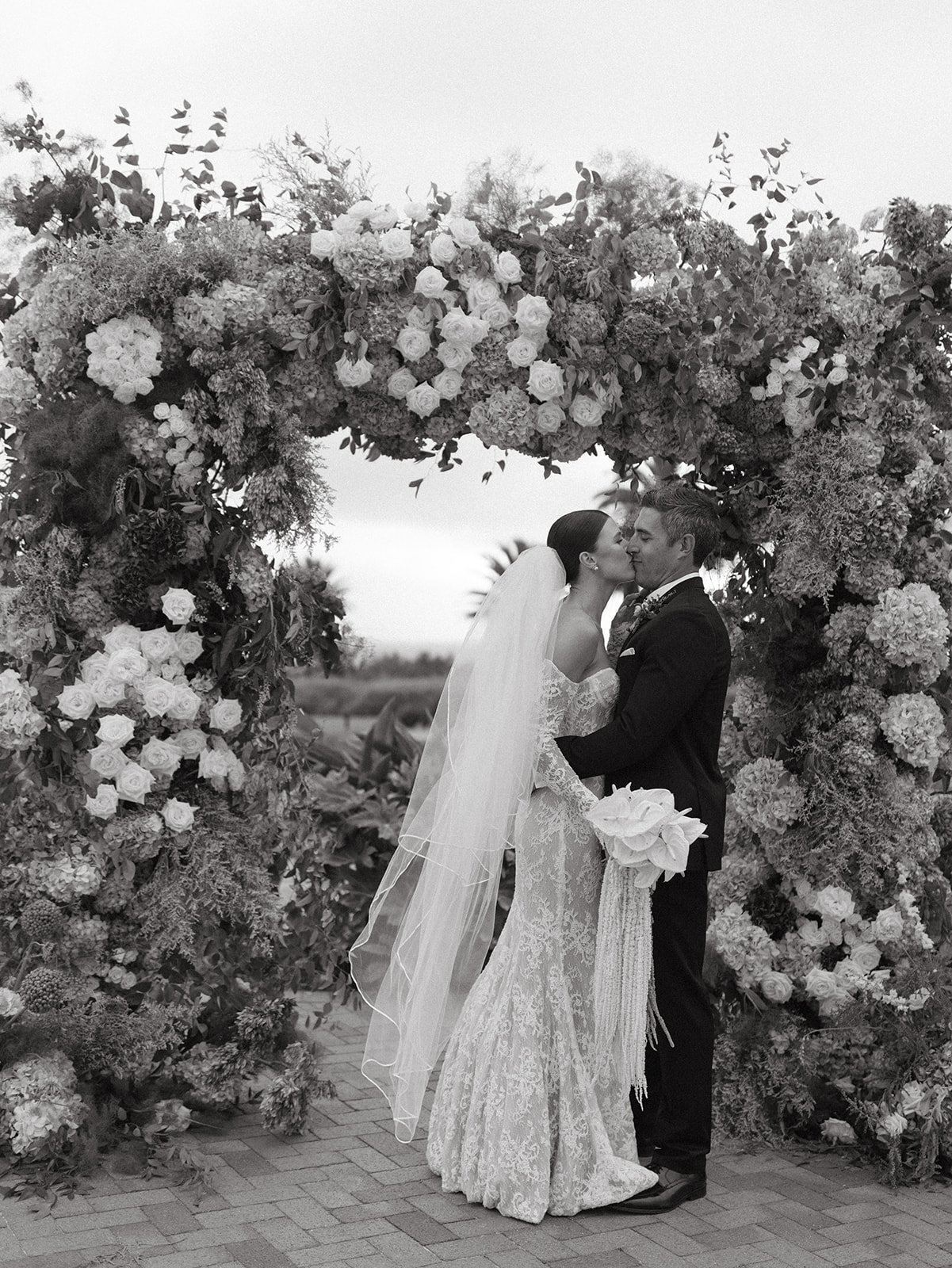 Editorial wedding photos of a bride and groom at their wedding ceremony site