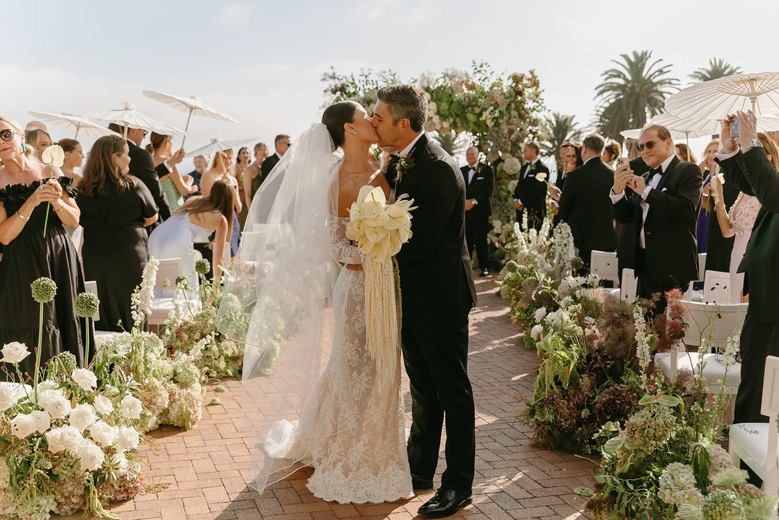 A bride and groom exiting their wedding ceremony