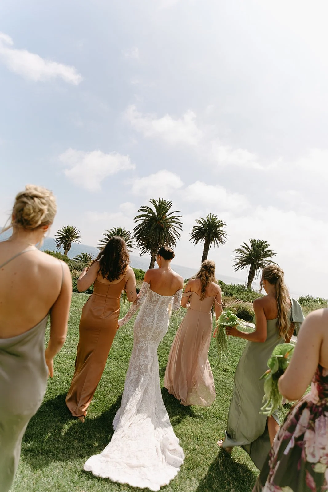 A bride and bridesmaids taking photos at Terranea Resort