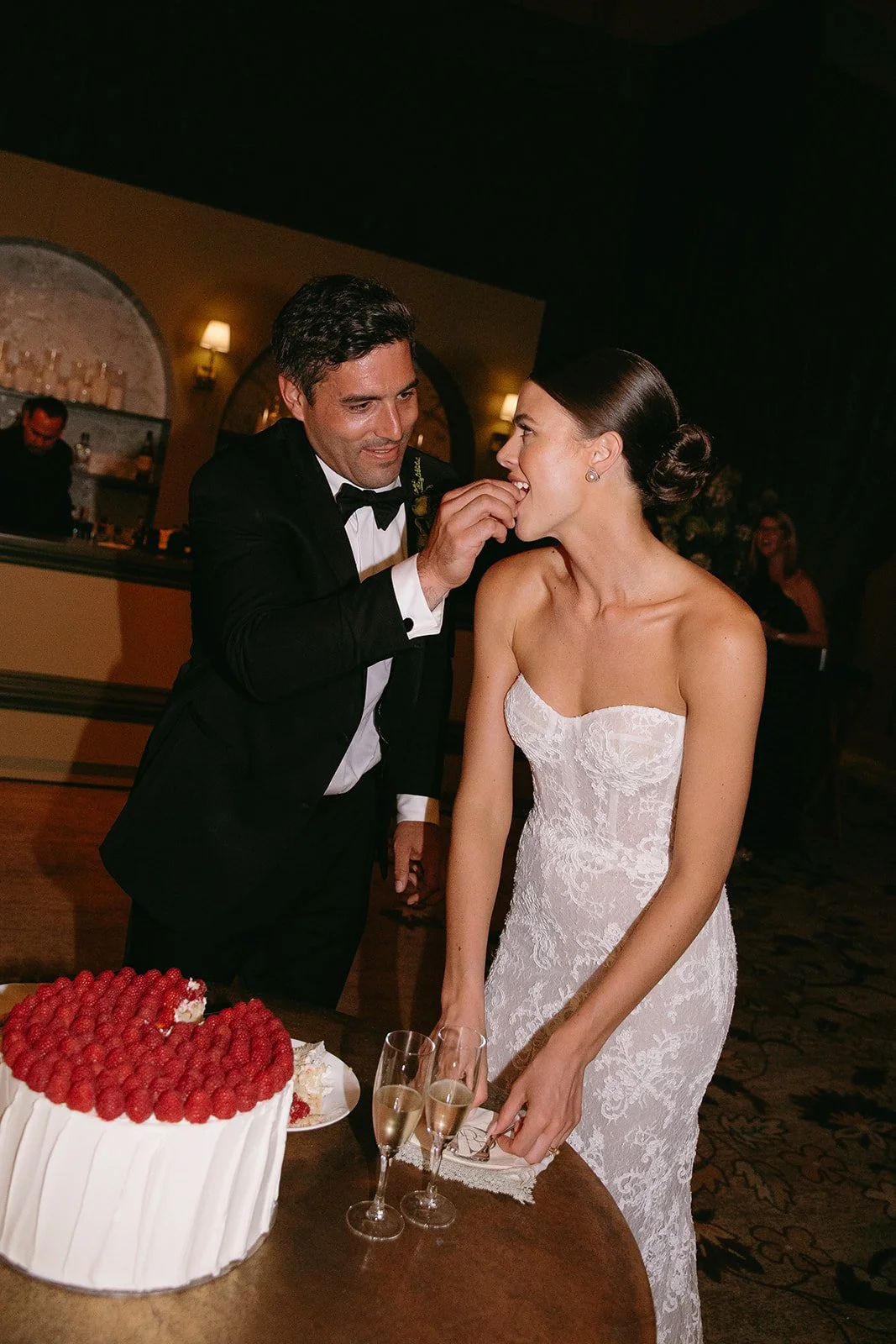 A bride and groom during their cake cutting