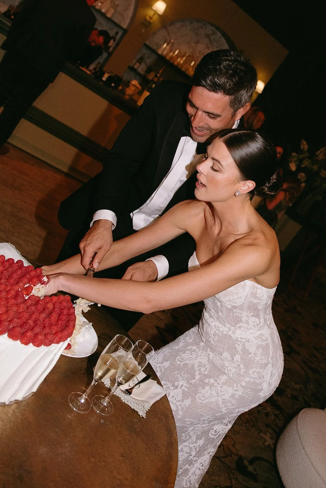 A bride and groom during their cake cutting
