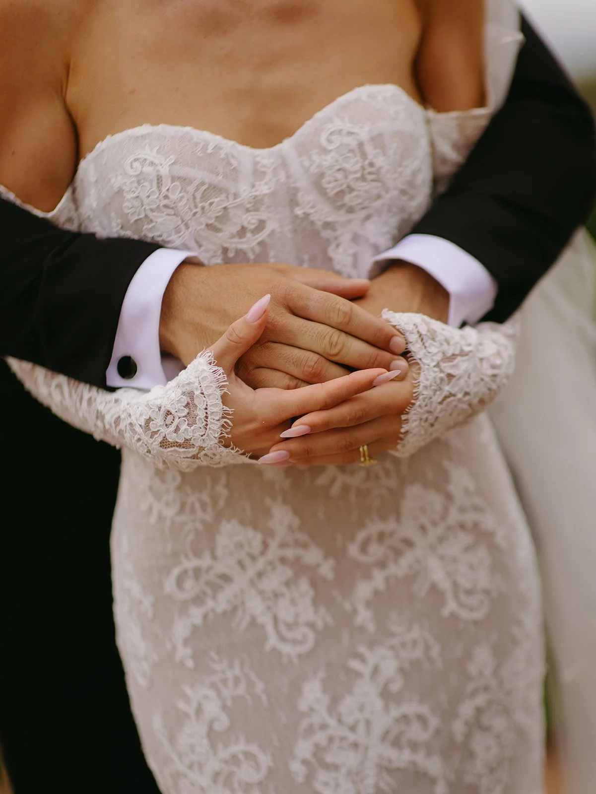 A bride and groom posing for wedding photos