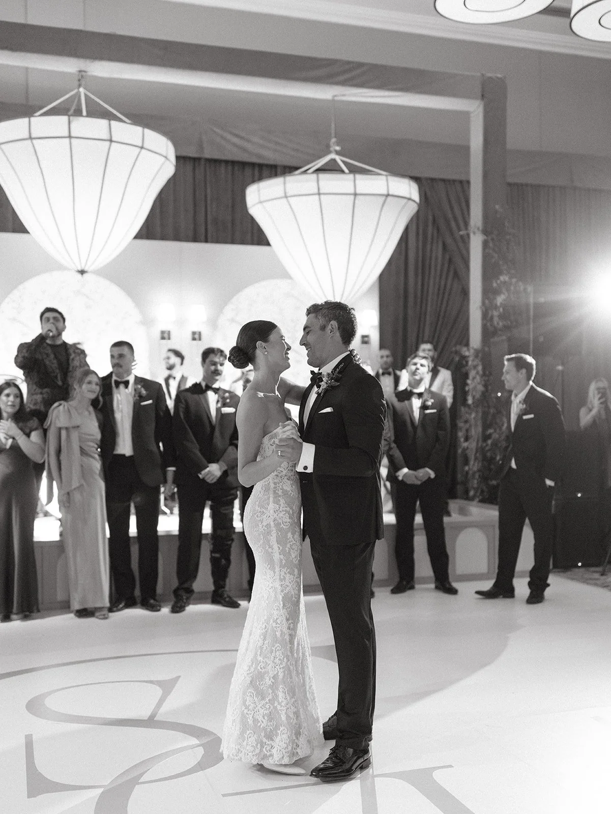 A bride and groom dancing at their wedding reception
