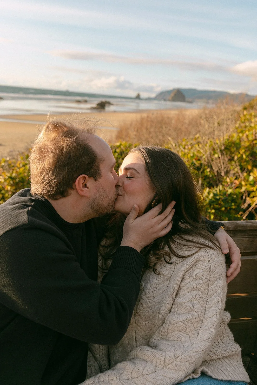 A couple taking choosing where engagement photos on Cannon Beach