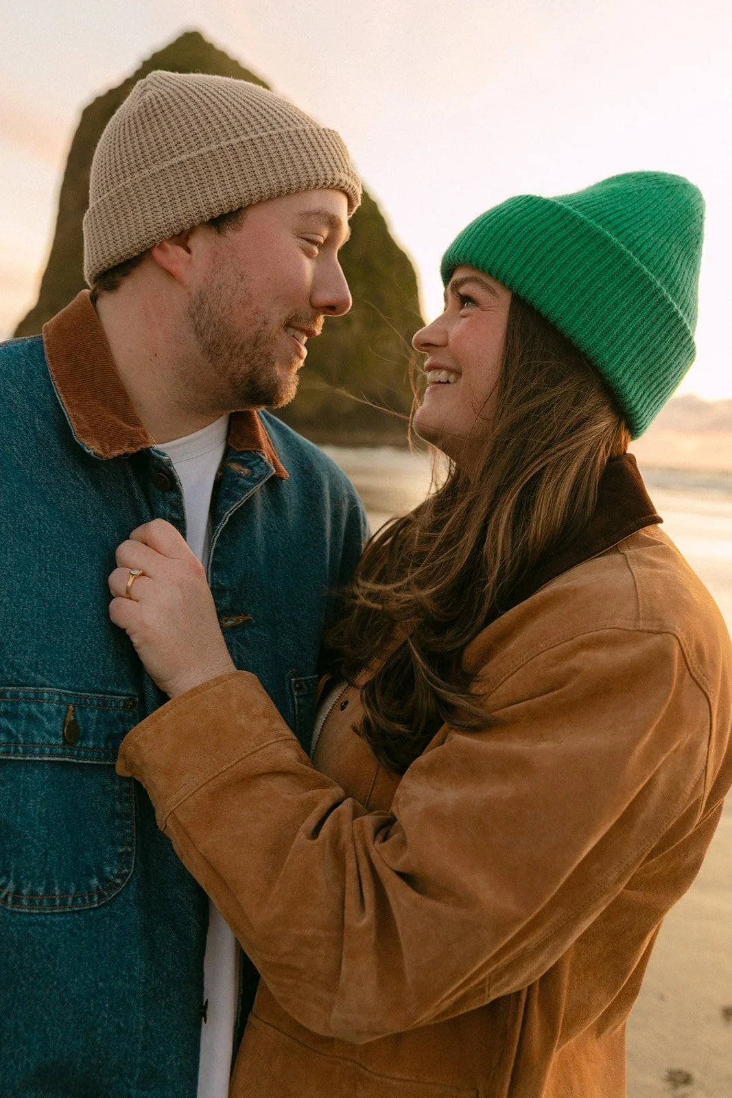 A couple choosing Cannon Beach for where to take engagement photos
