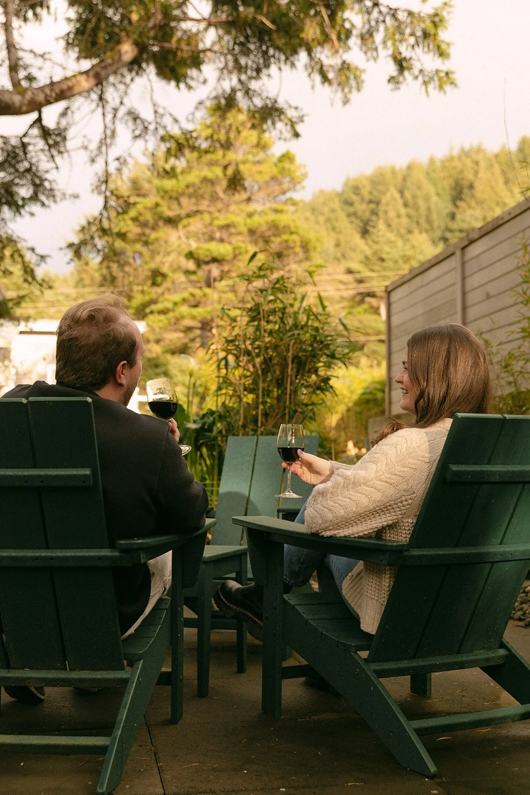 A couple taking porch engagement photos