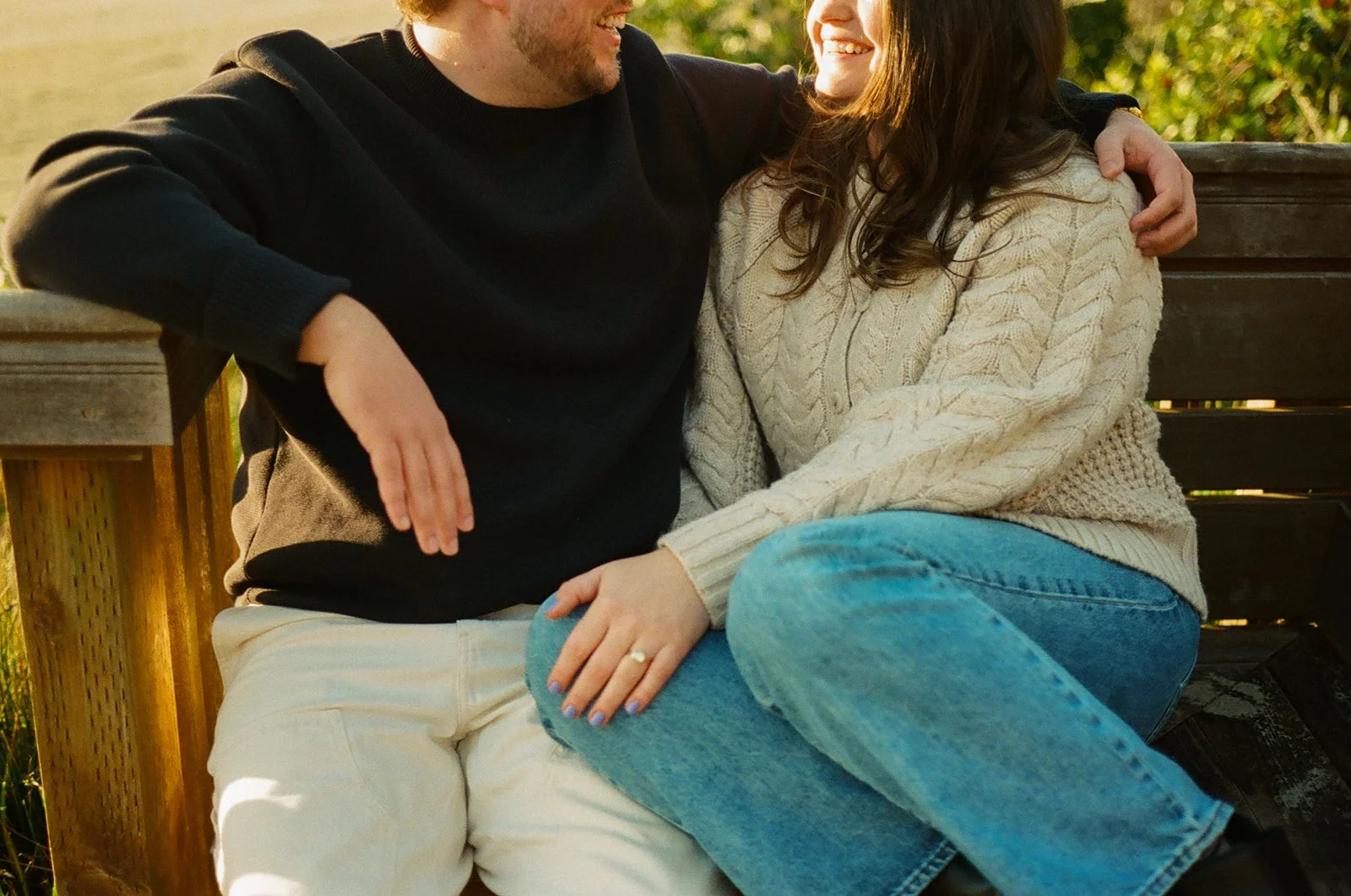A couple taking romantic engagement photos in a family home