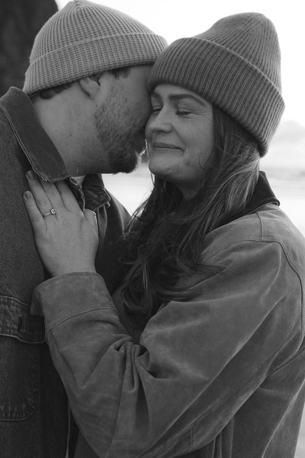 Black and white engagement photos on CAnnon Beach