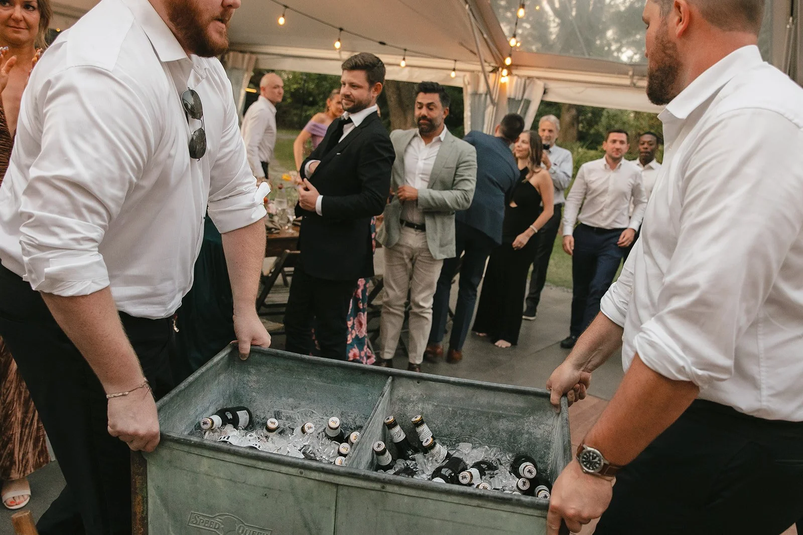 Groomsmen bringing out beers as memorial ideas for wedding