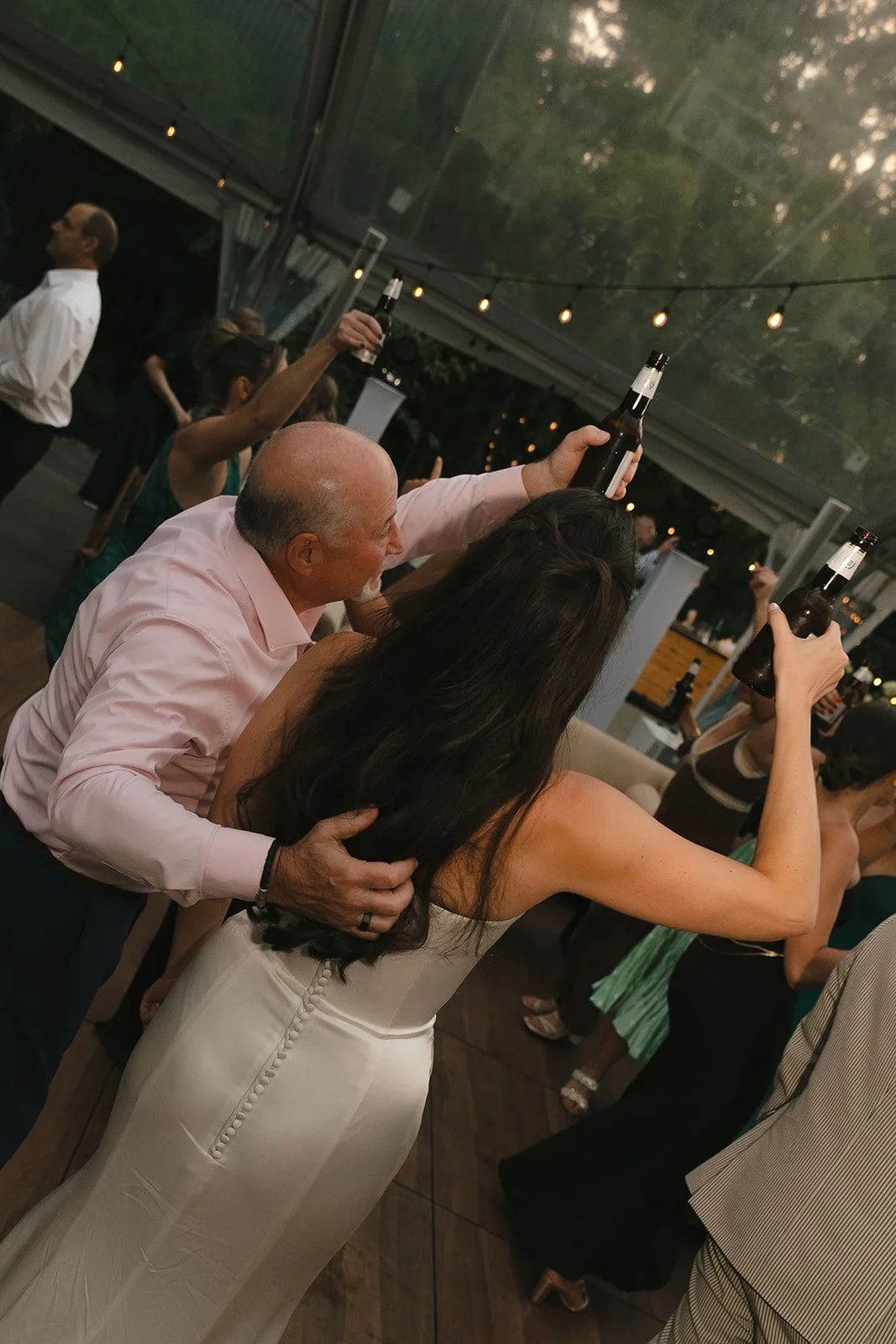 A wedding reception toasting to the bride's father, as a memorial idea for weddings