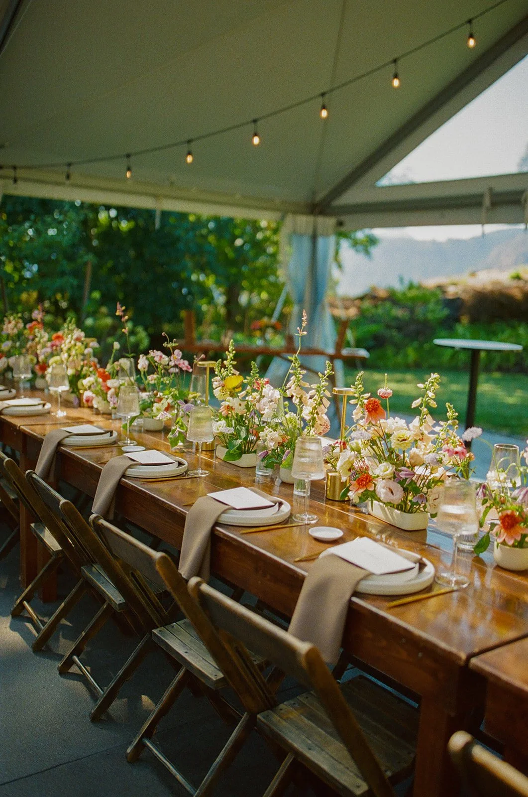 A wedding reception outside under a tent