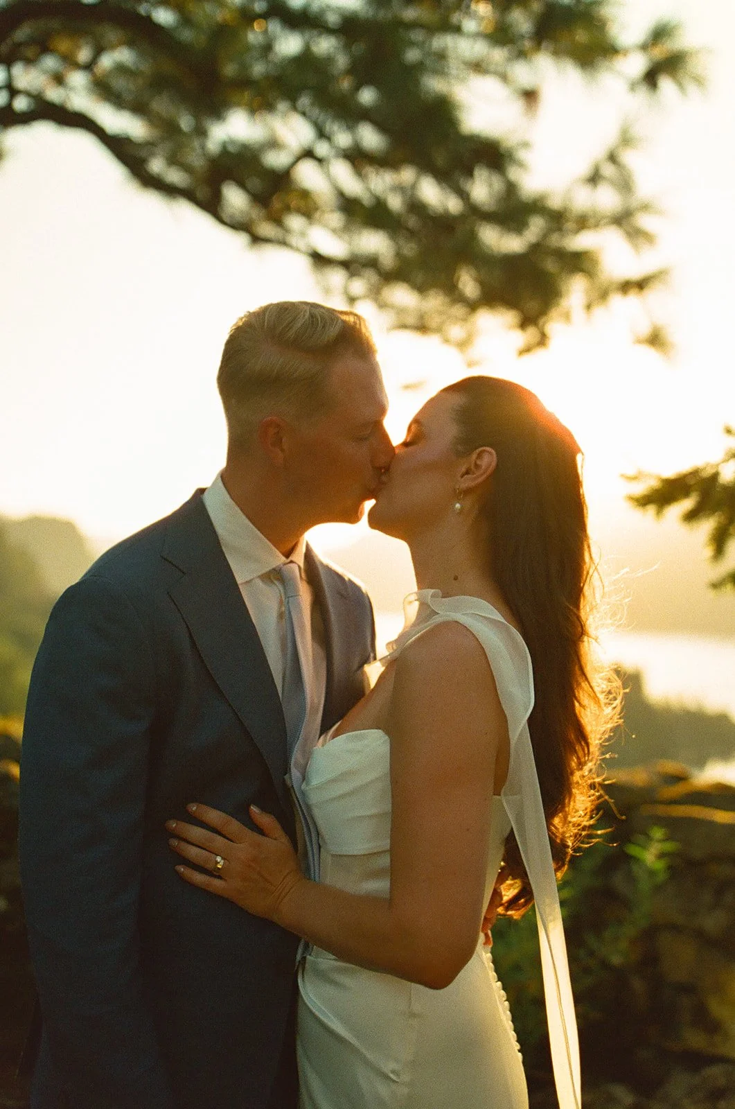 A bride and groom posing for golden hour wedding photos