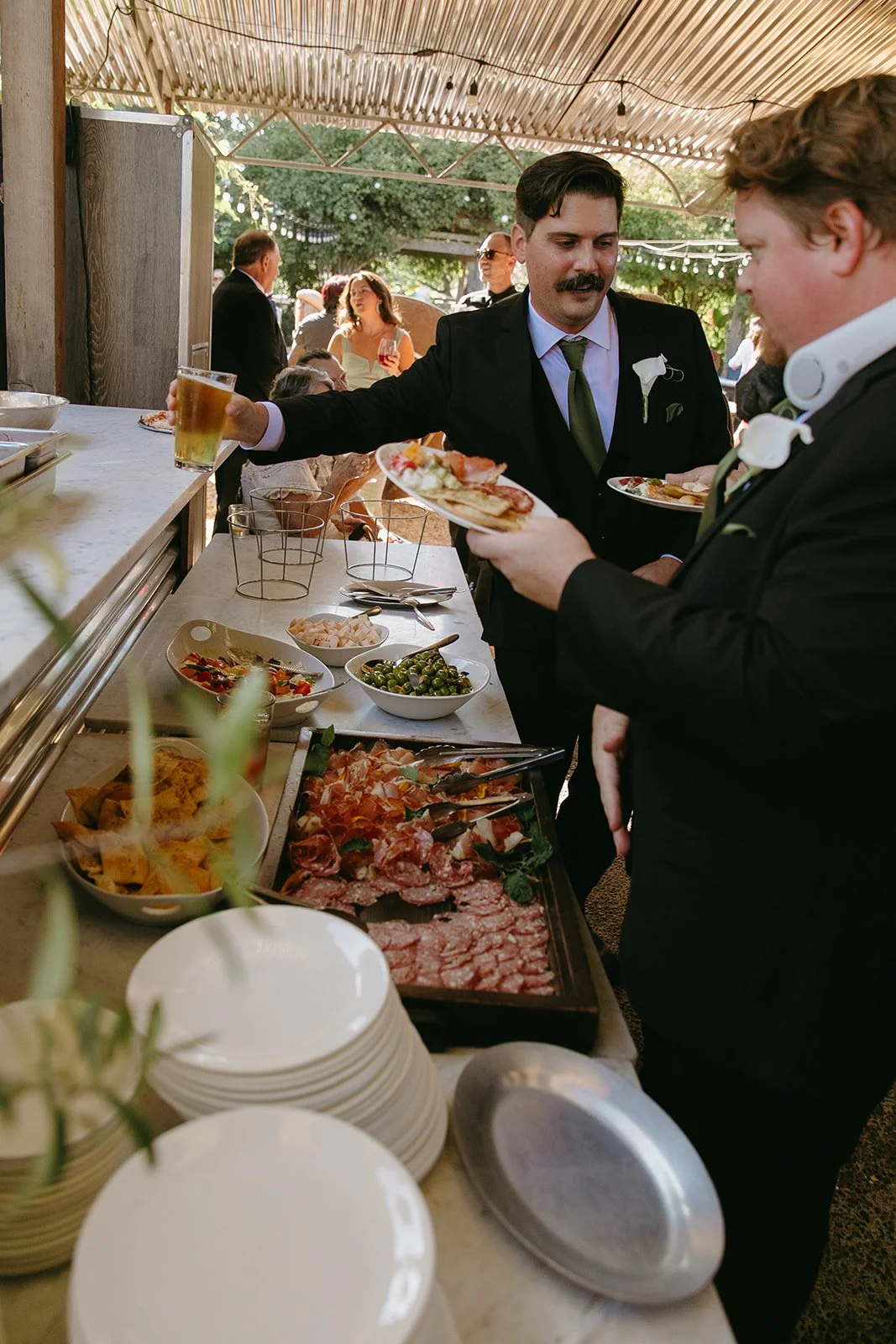 Guests getting food at a restaurant wedding