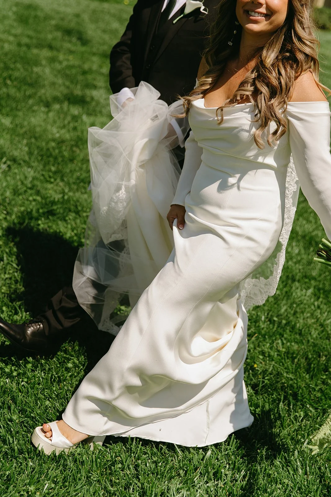 A bride and groom walking