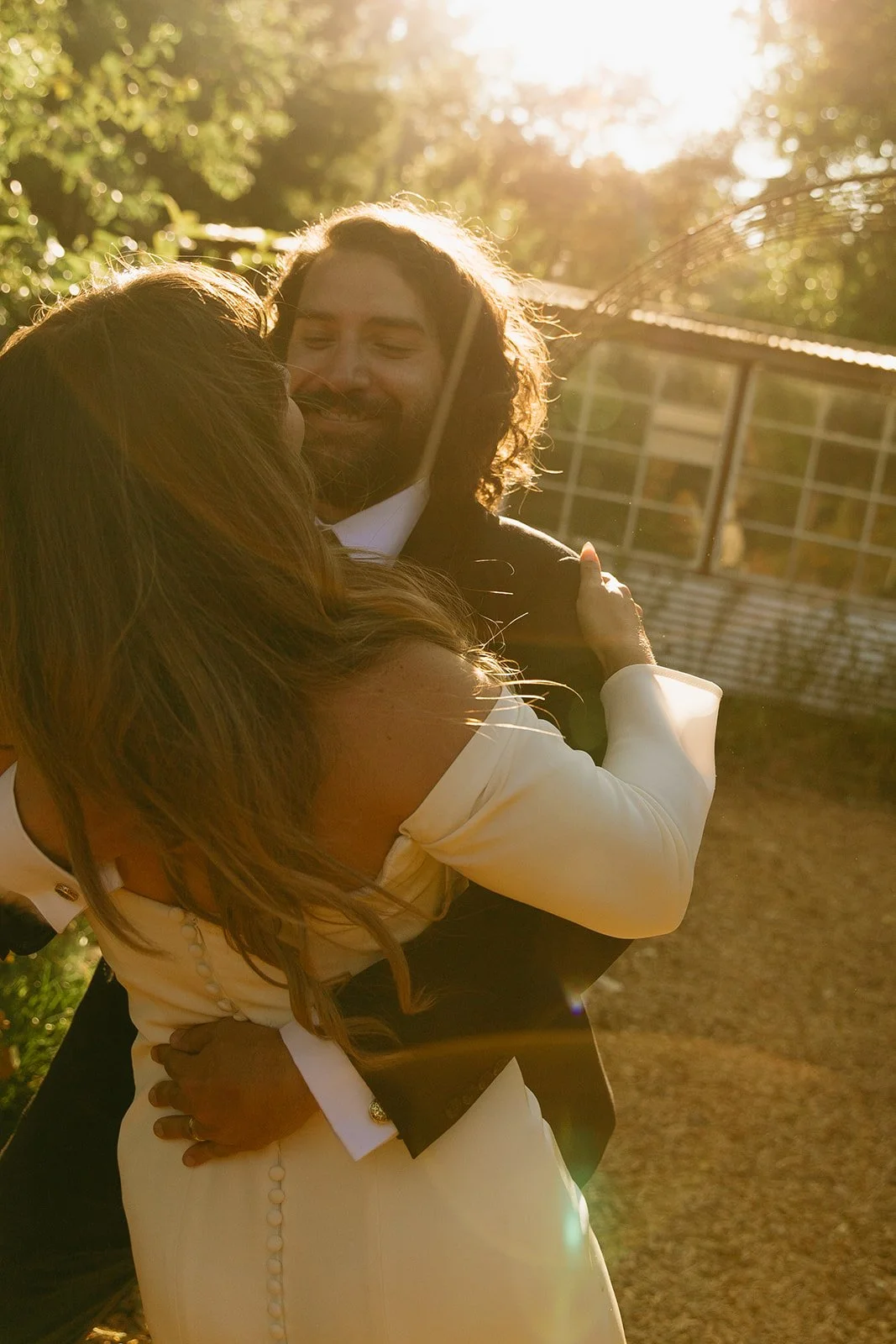 A bride and groom during sunset wedding photos