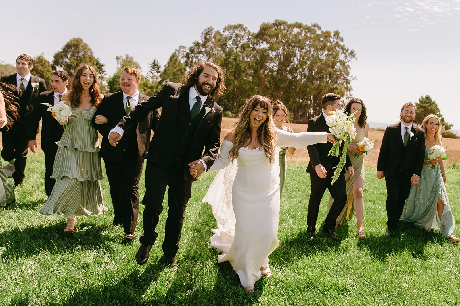 A wedding party cheering in photos