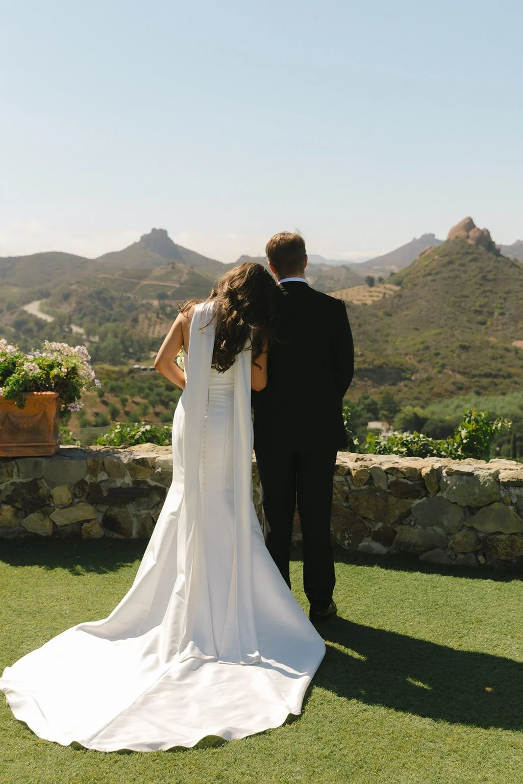 A bride and groom posing for wedding photos