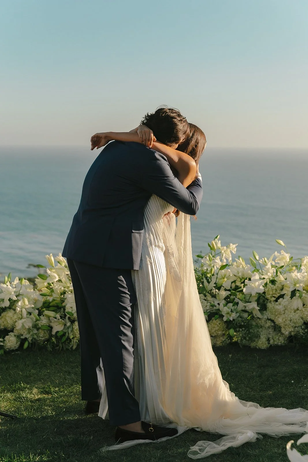A couple during their wedding ceremony at malibu sea view estate