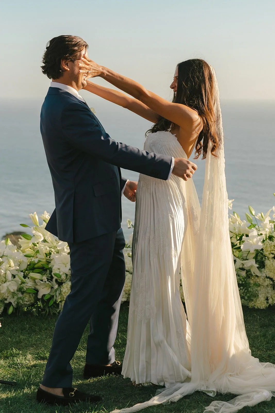 A couple during their wedding ceremony at malibu sea view estate