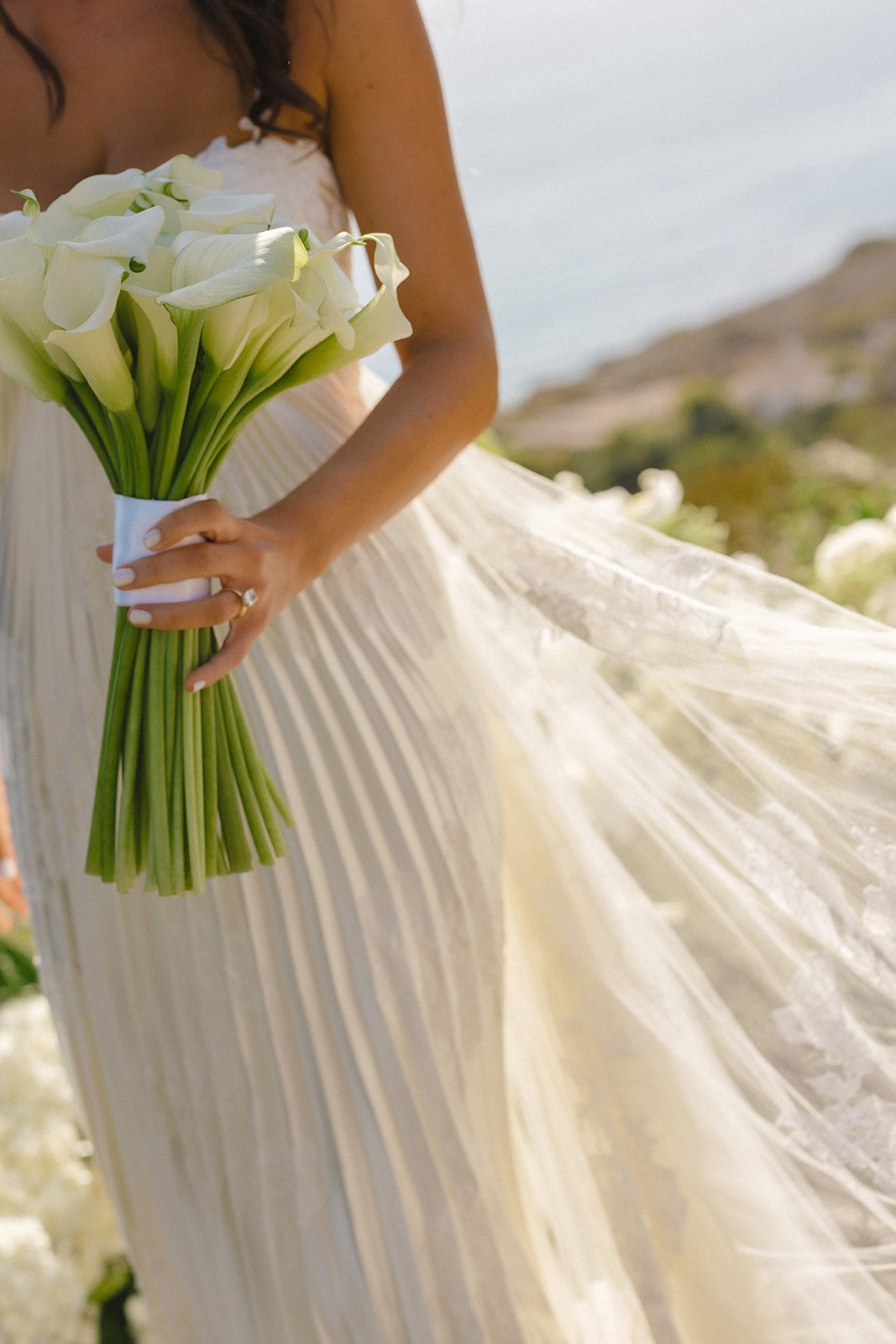 A bride's wedding dress details