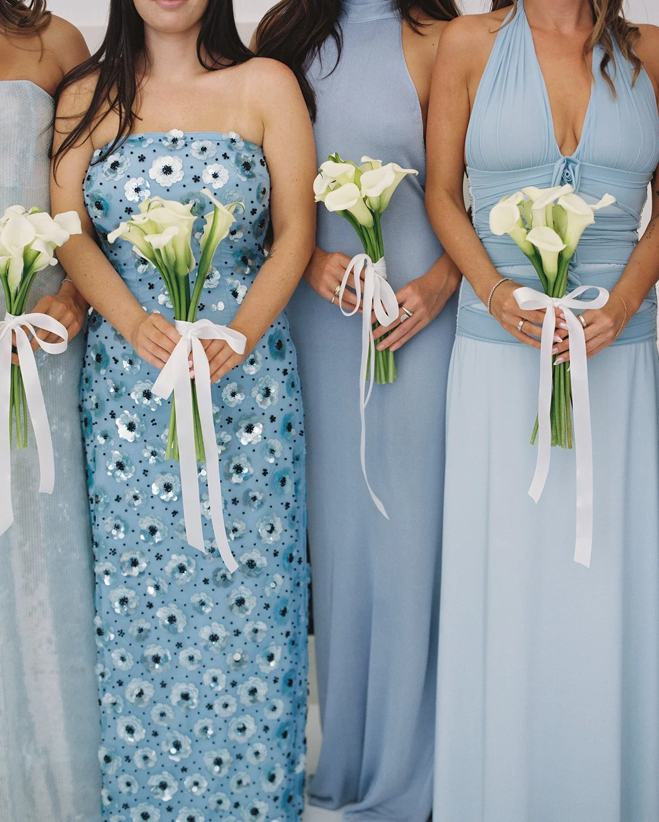Bridesmaids wearing baby blue bridesmaid dresses