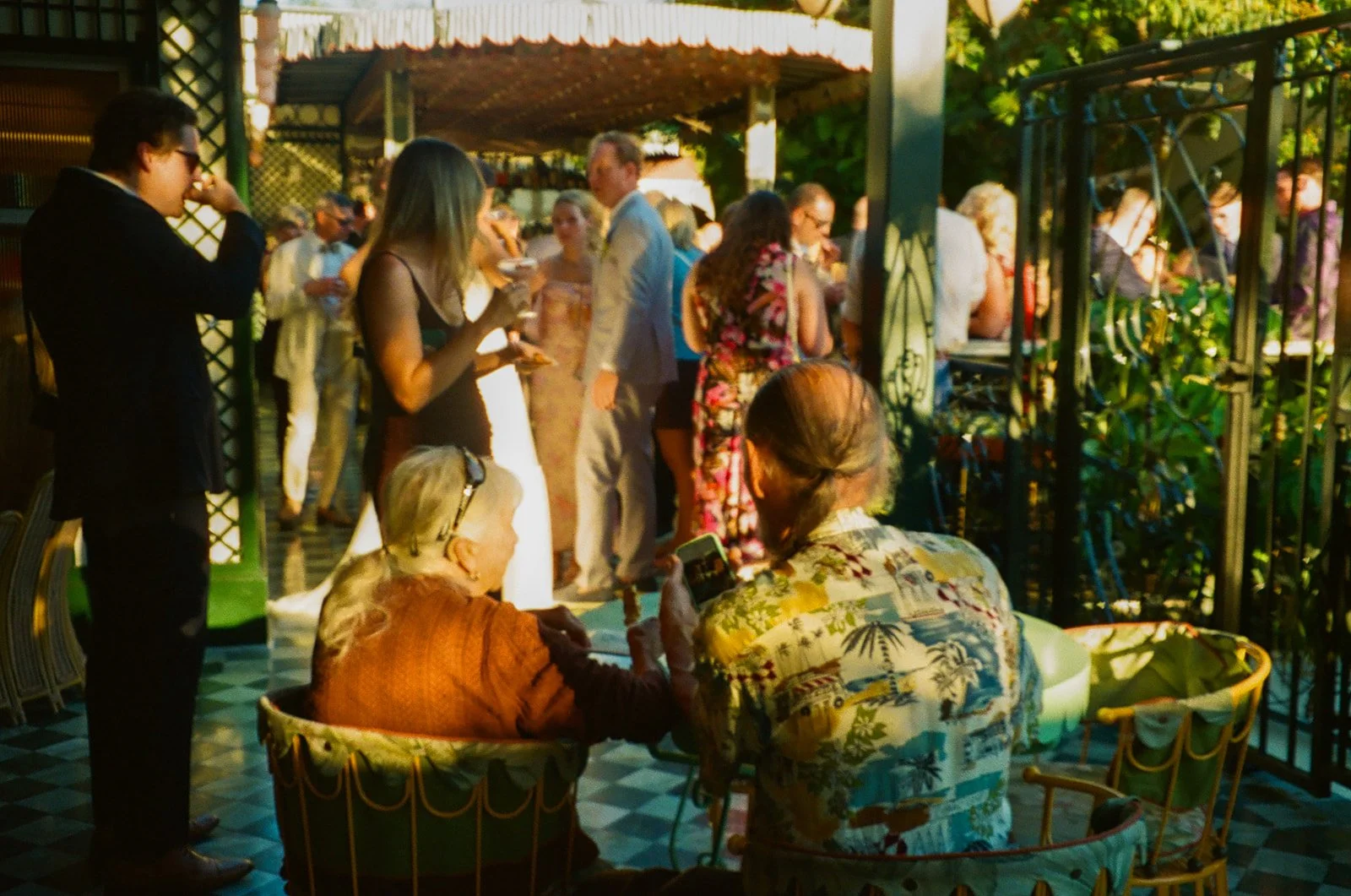 Wedding guests at a Lafayette Hotel cocktail hour on film