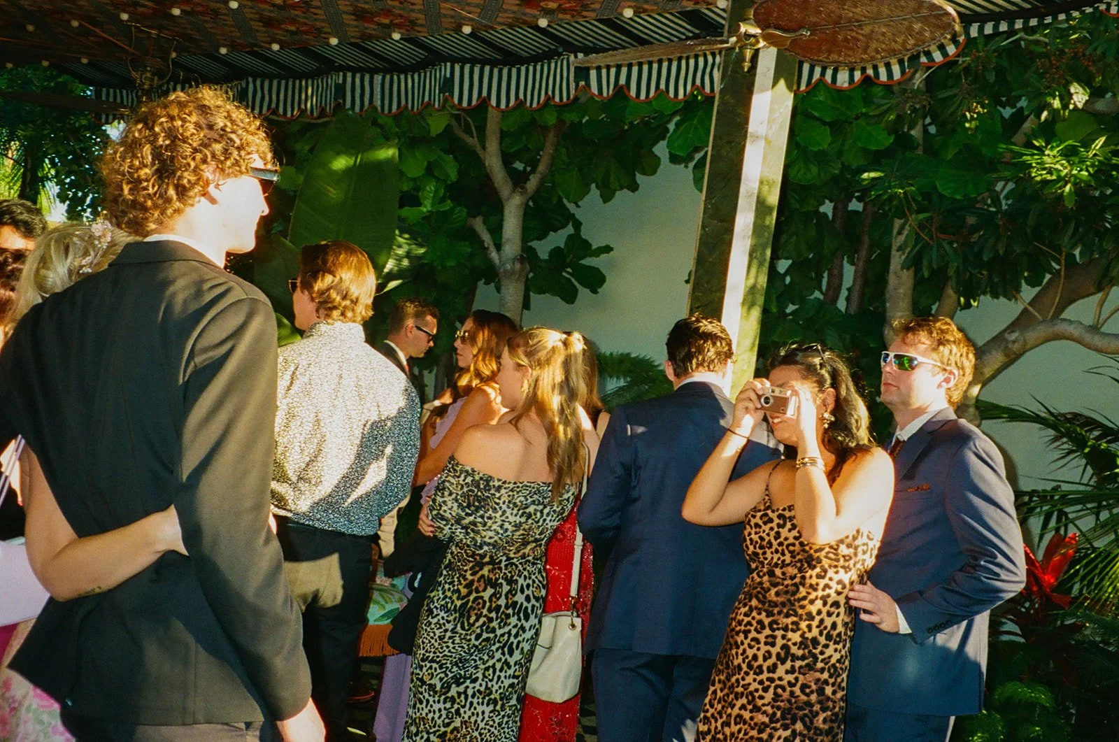 Wedding guests at a Lafayette Hotel cocktail hour on film