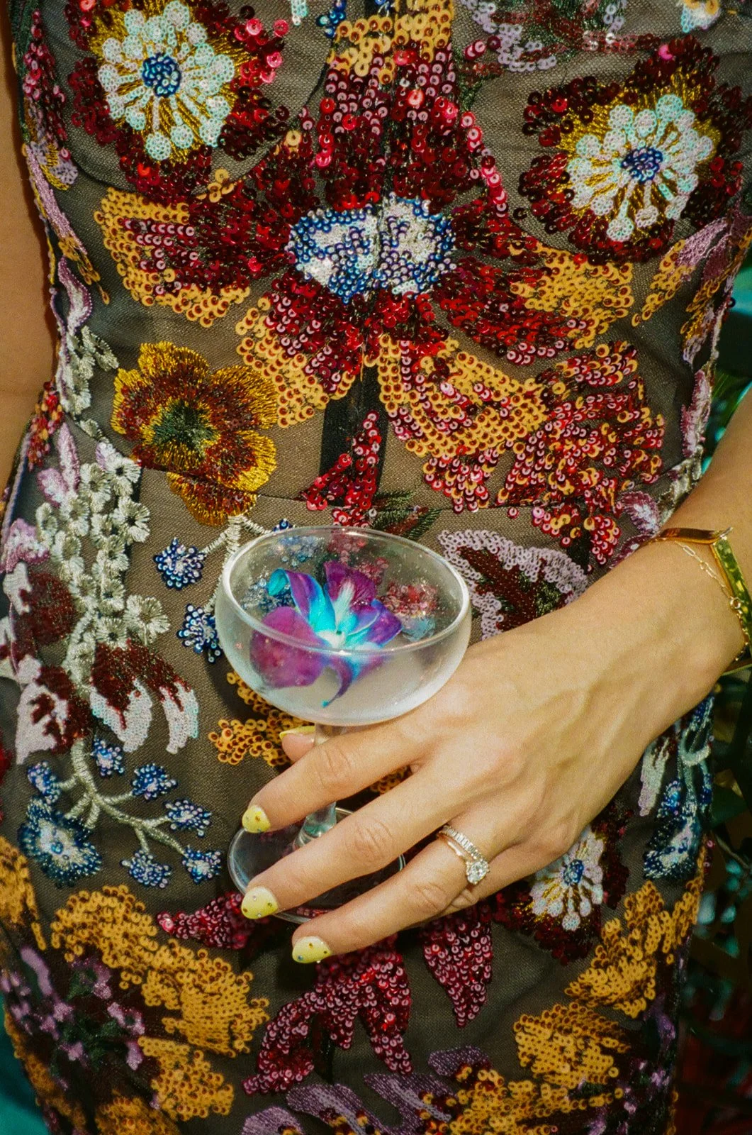 A wedding guest holding a drink at a Lafayette Hotel wedding