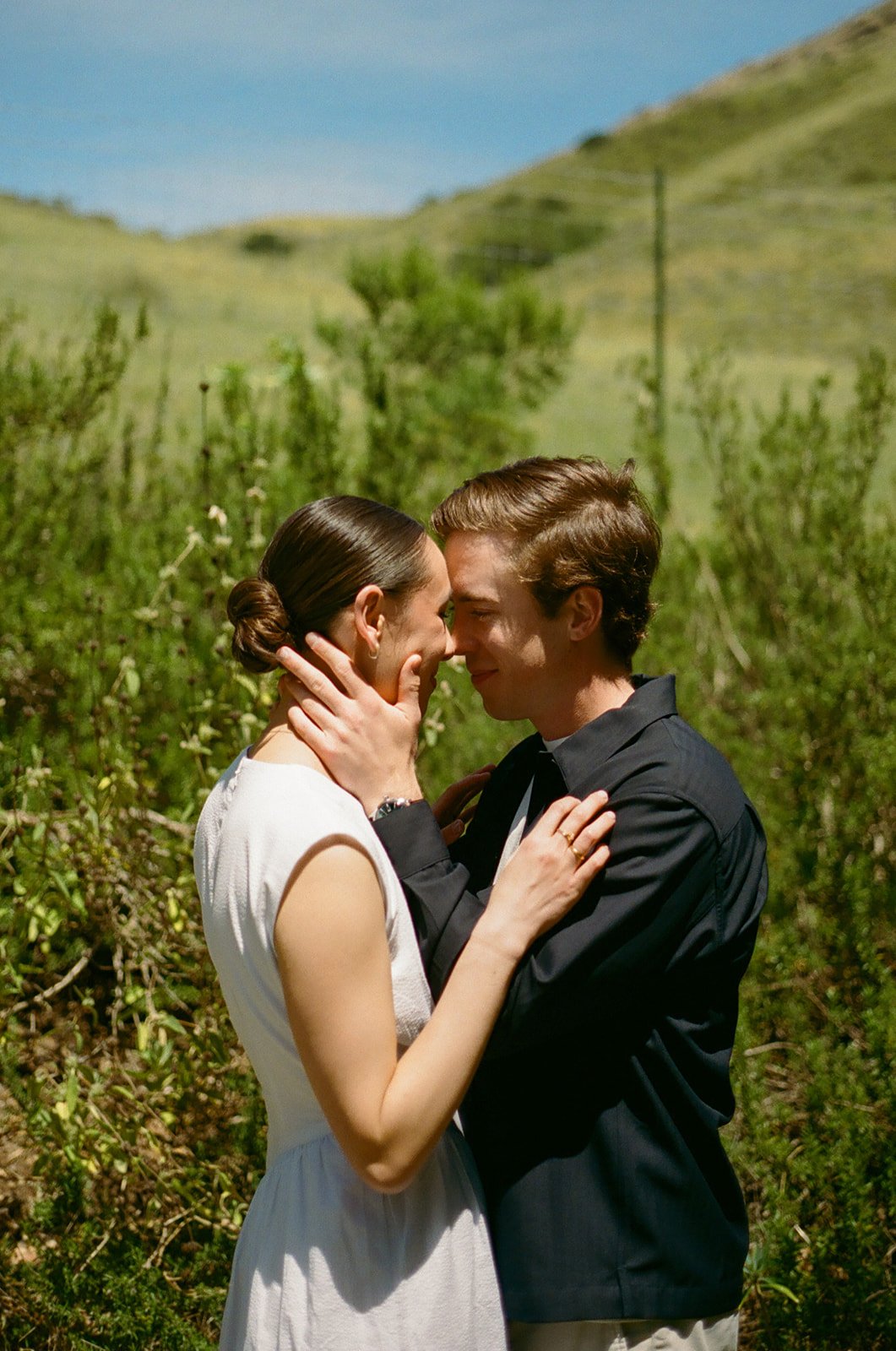 A couple taking engagement photos at Cal Poly Botanical GArdens