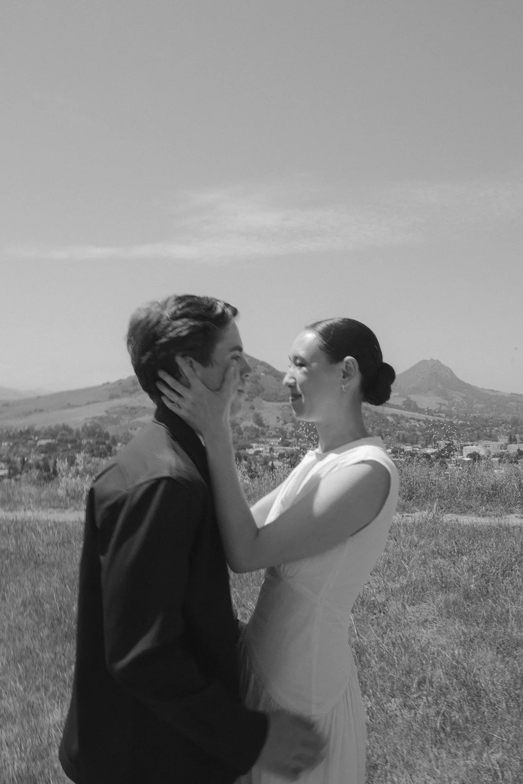 A couple taking engagement photos on Terrace Hill