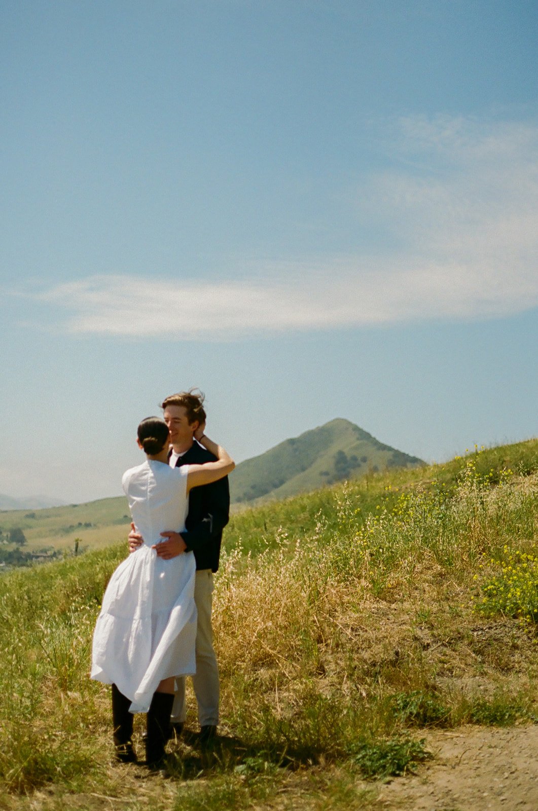 A couple kissing in film engagement photos