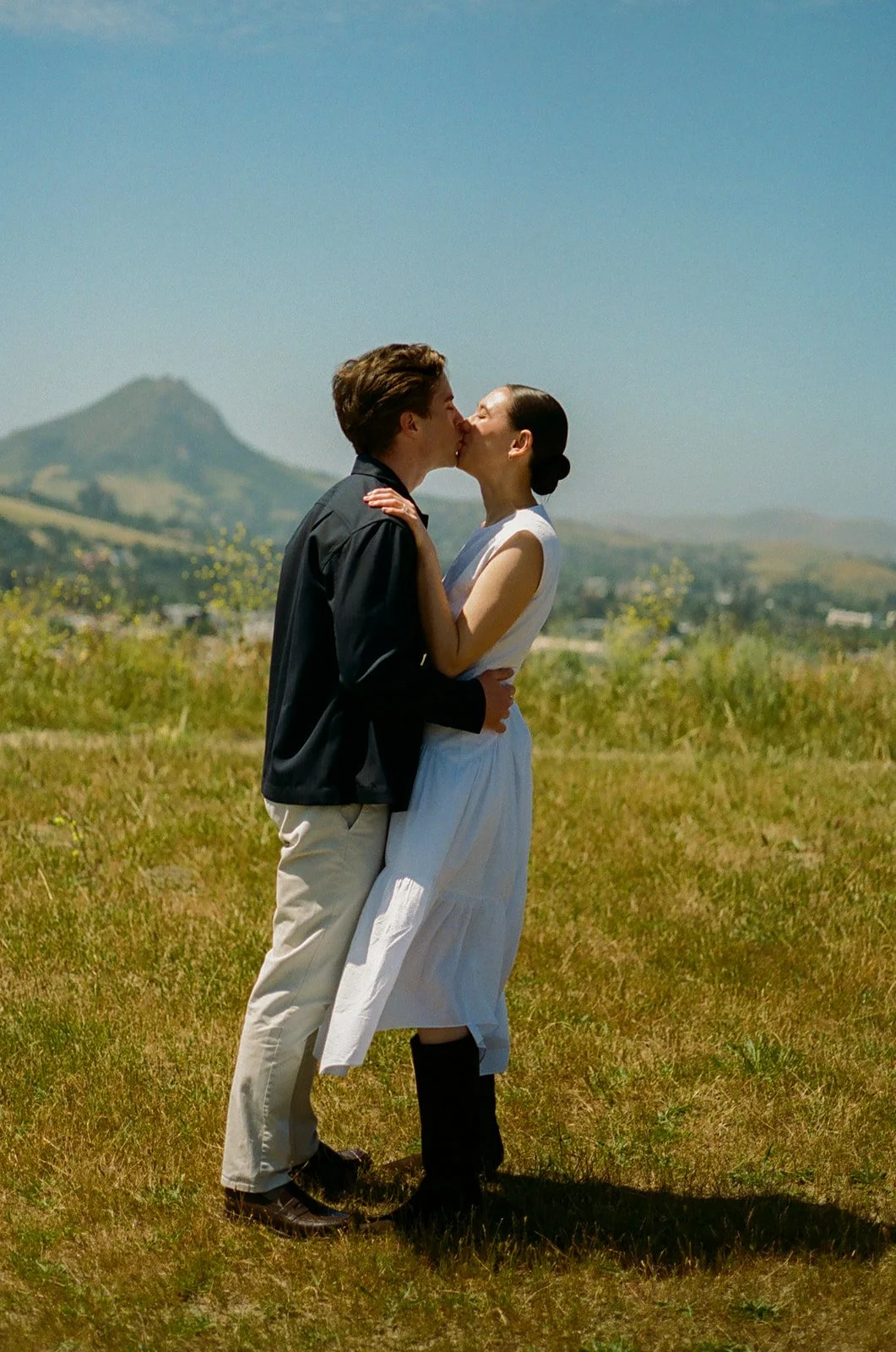 A couple kissing in film engagement photos