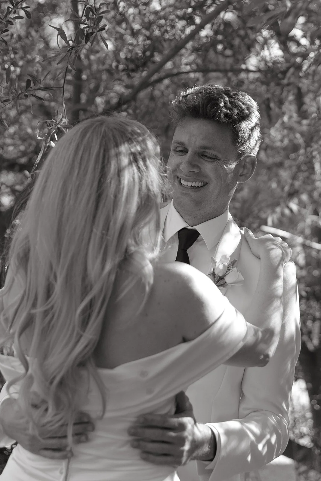 A black and white photo of a bride and groom at their Calamigos Ranch wedding