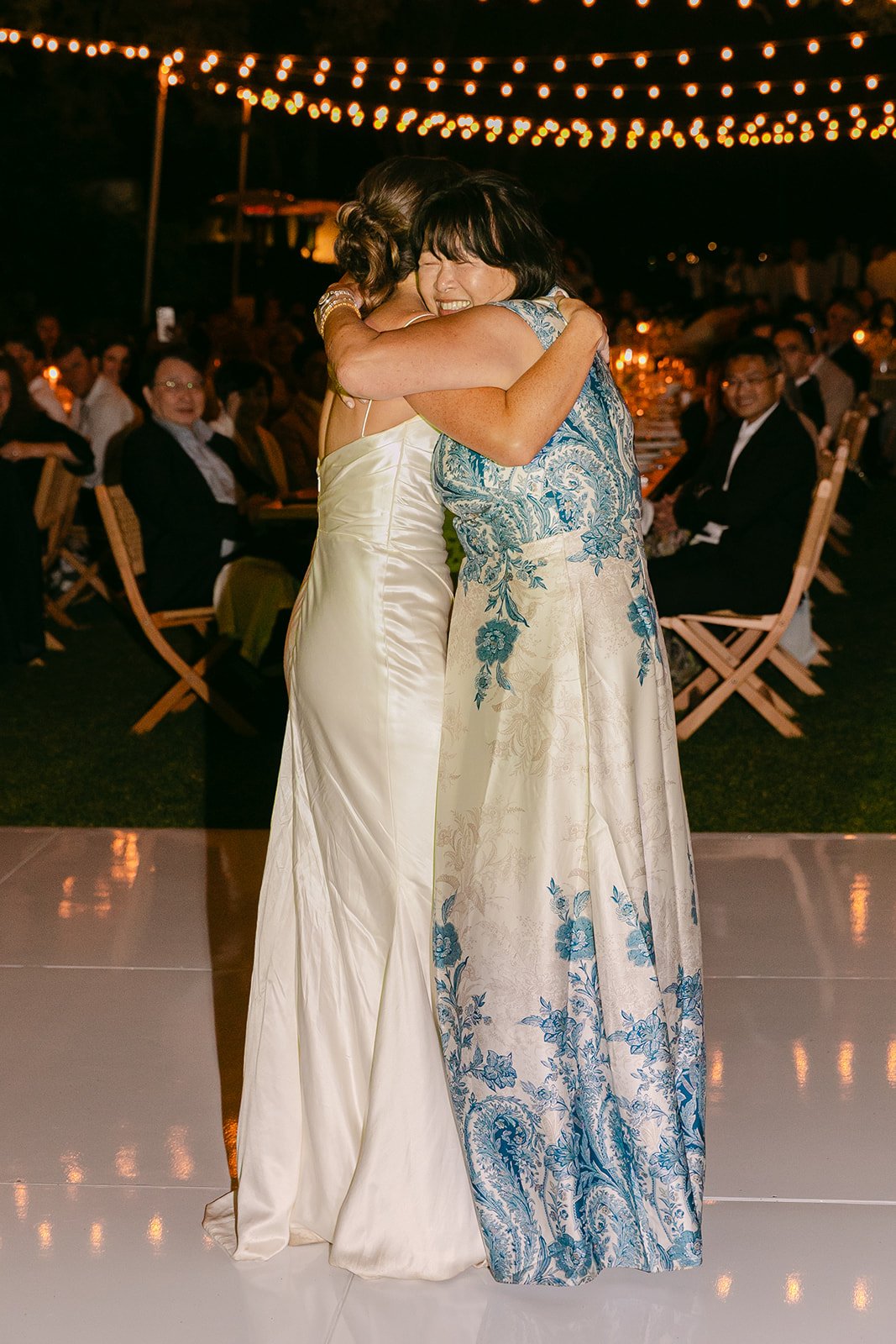 A bride and her mom dancing
