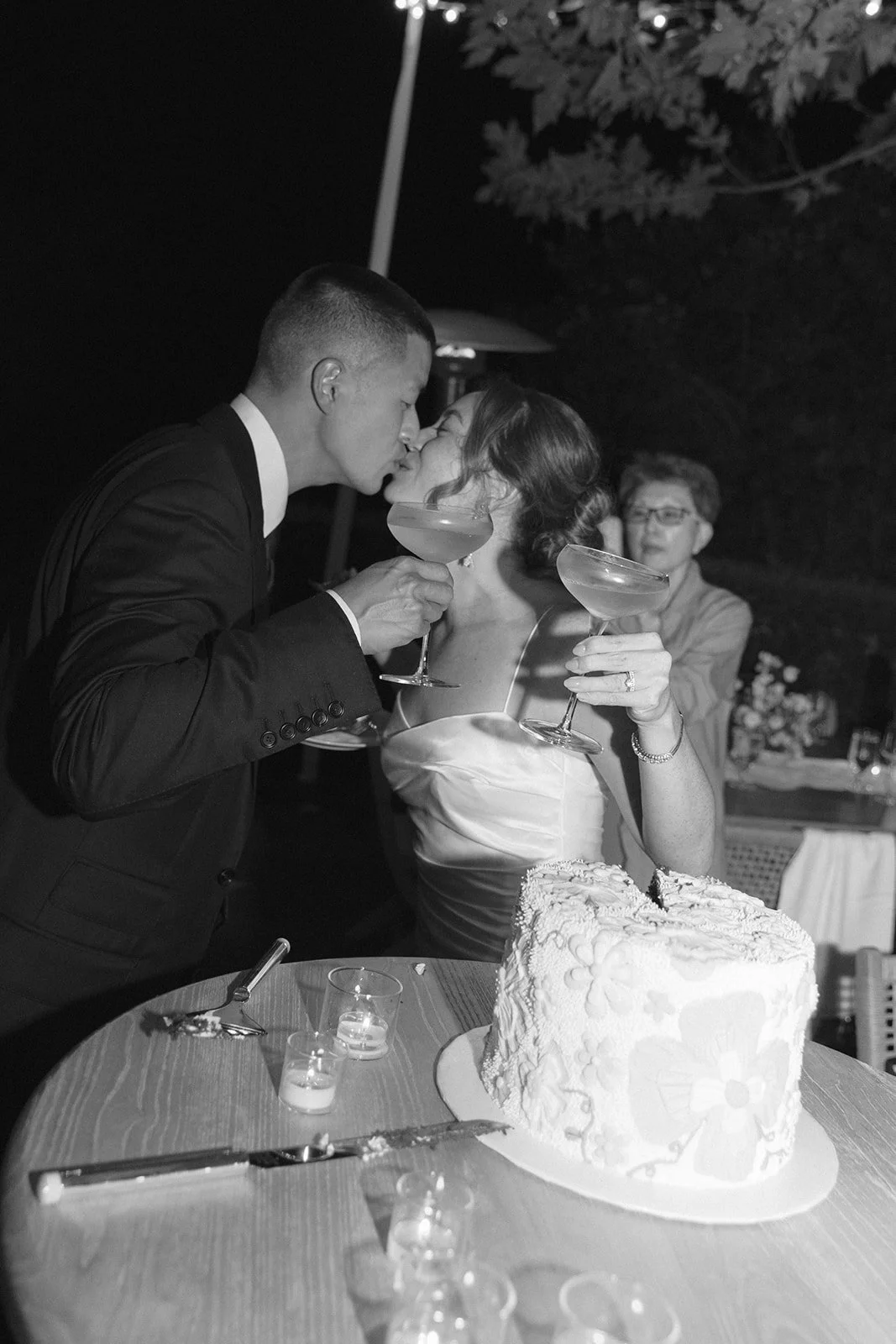 A bride and groom cutting their cake