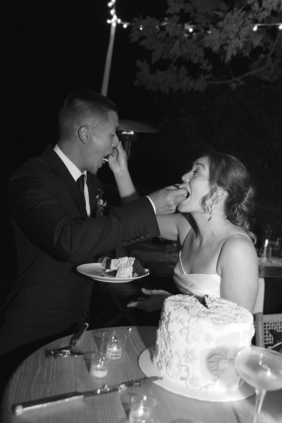 A bride and groom cutting their cake