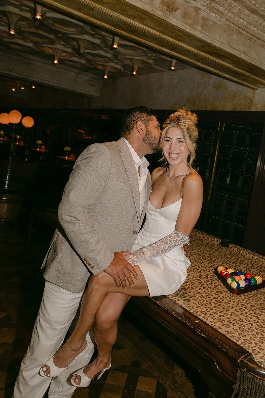 A couple posing for funky SoCal engagement photos