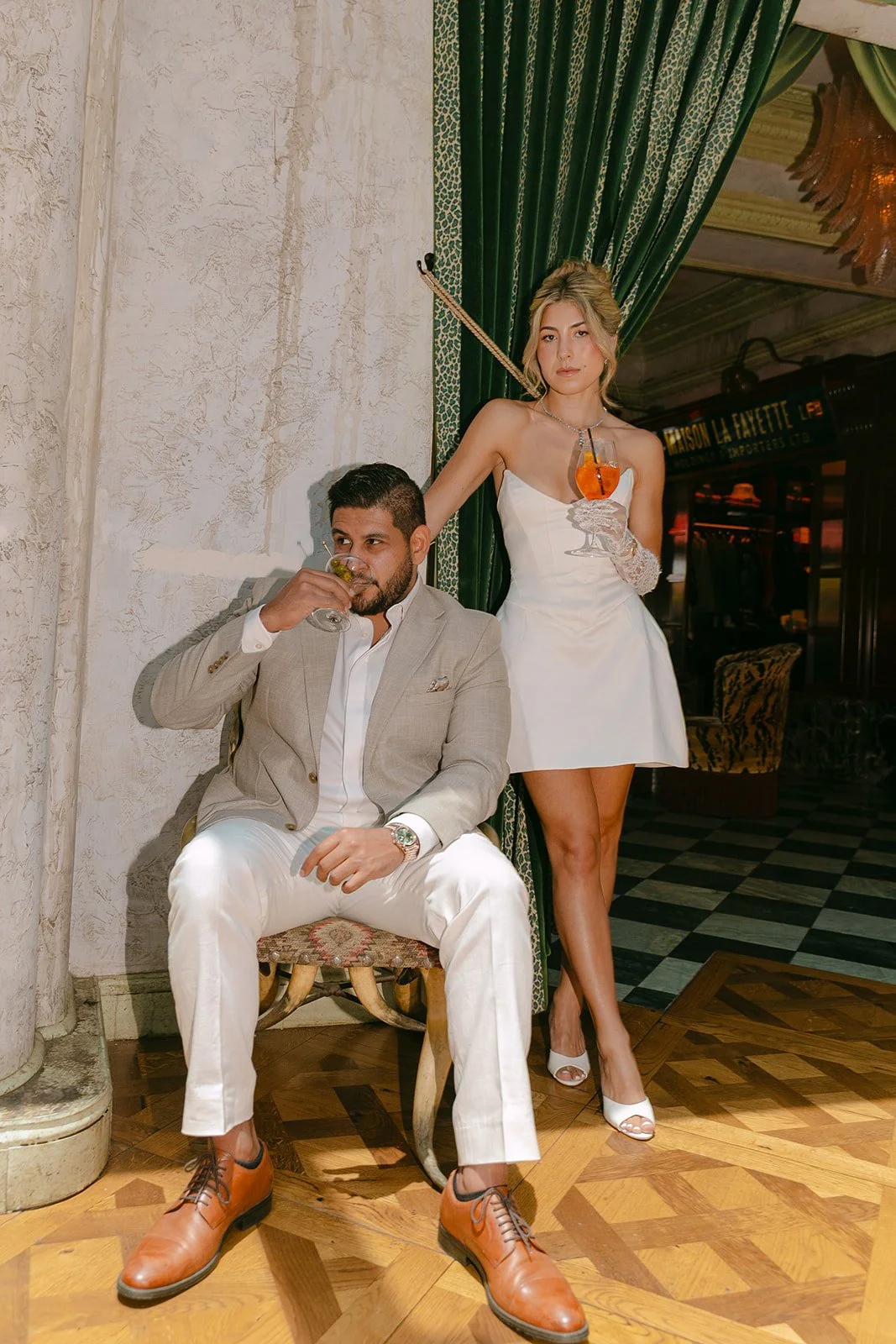 A couple posing for engagement photos at Lafayette Hotel