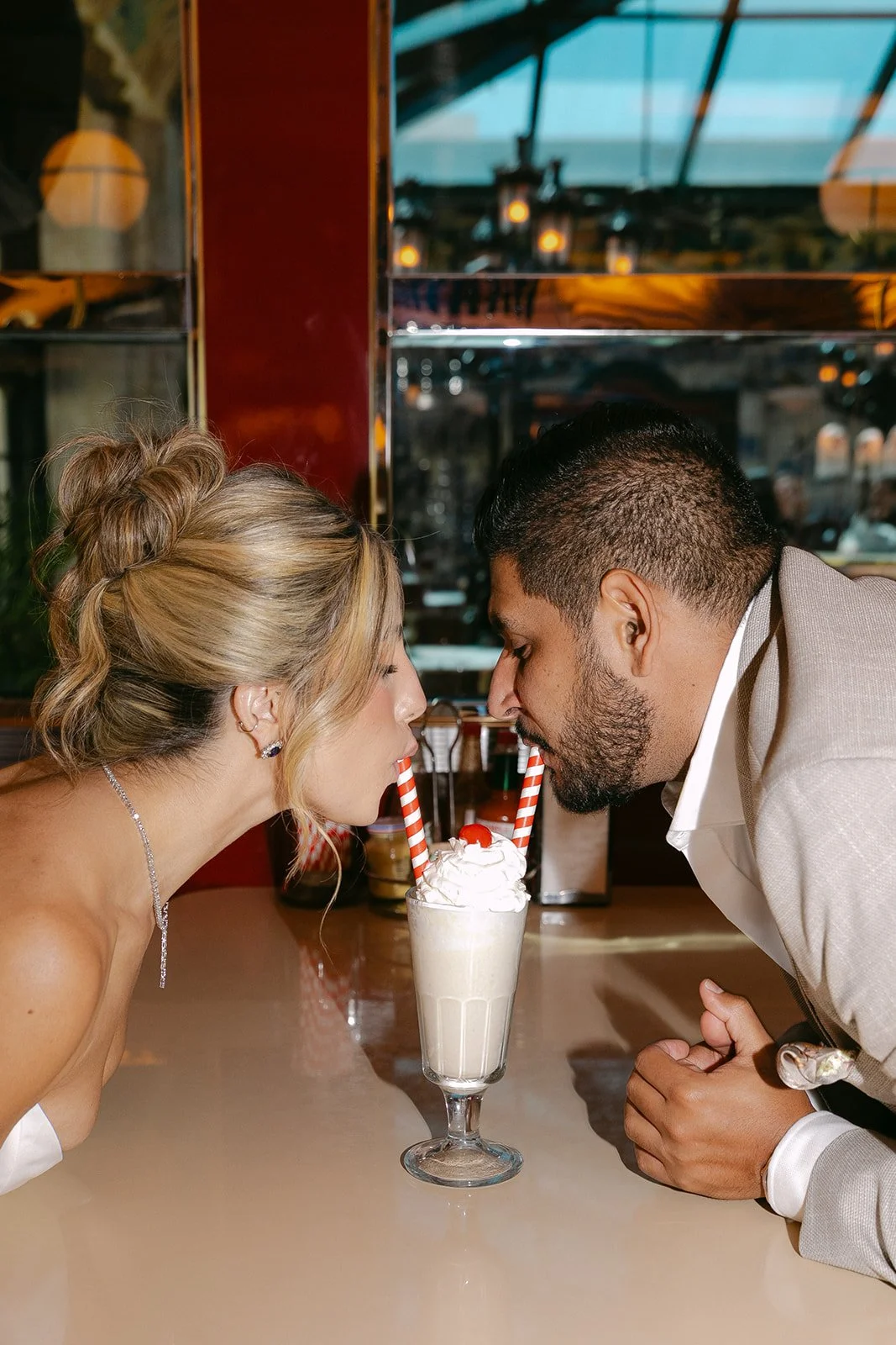 A couple taking diner engagement photos