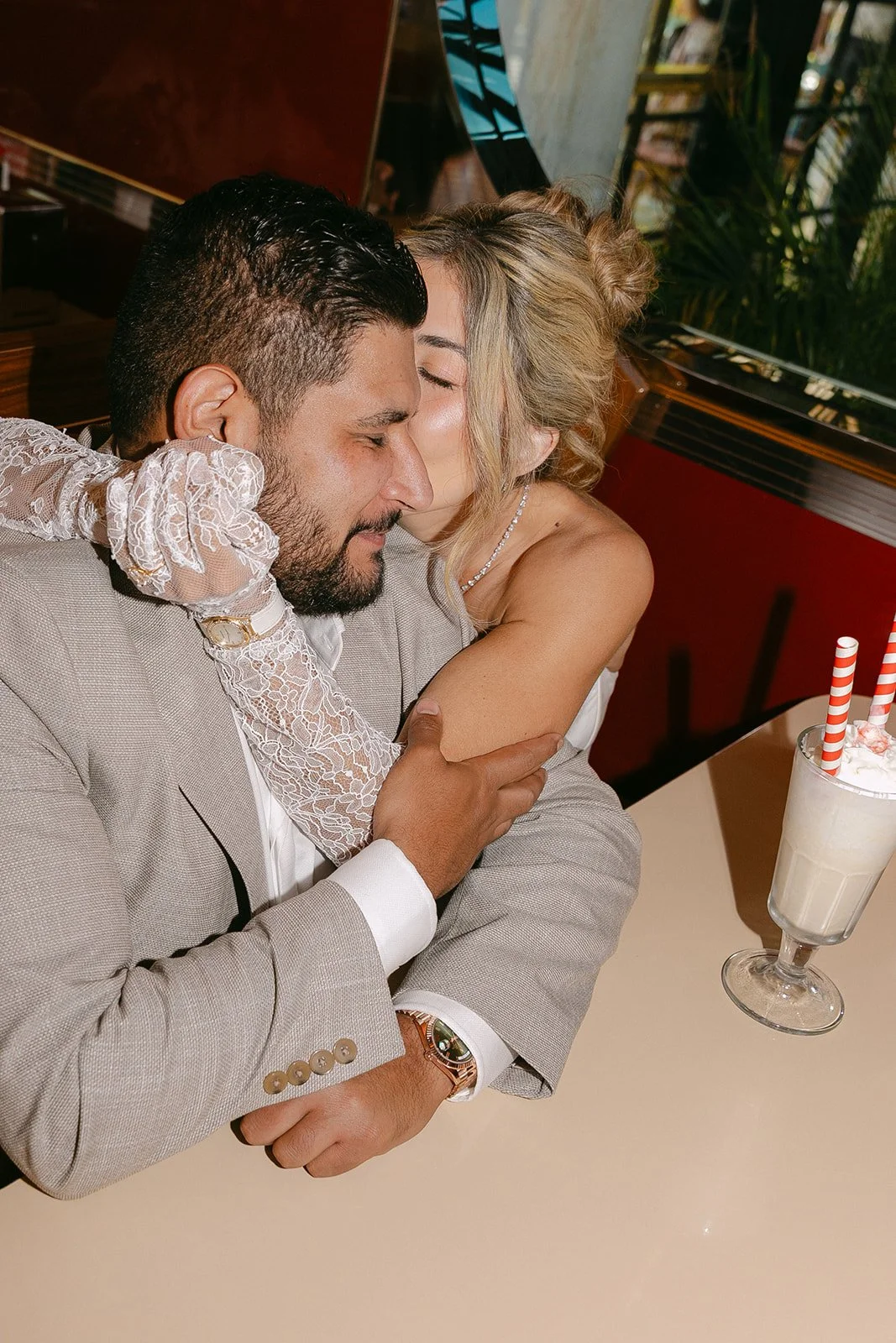 A couple taking diner engagement photos