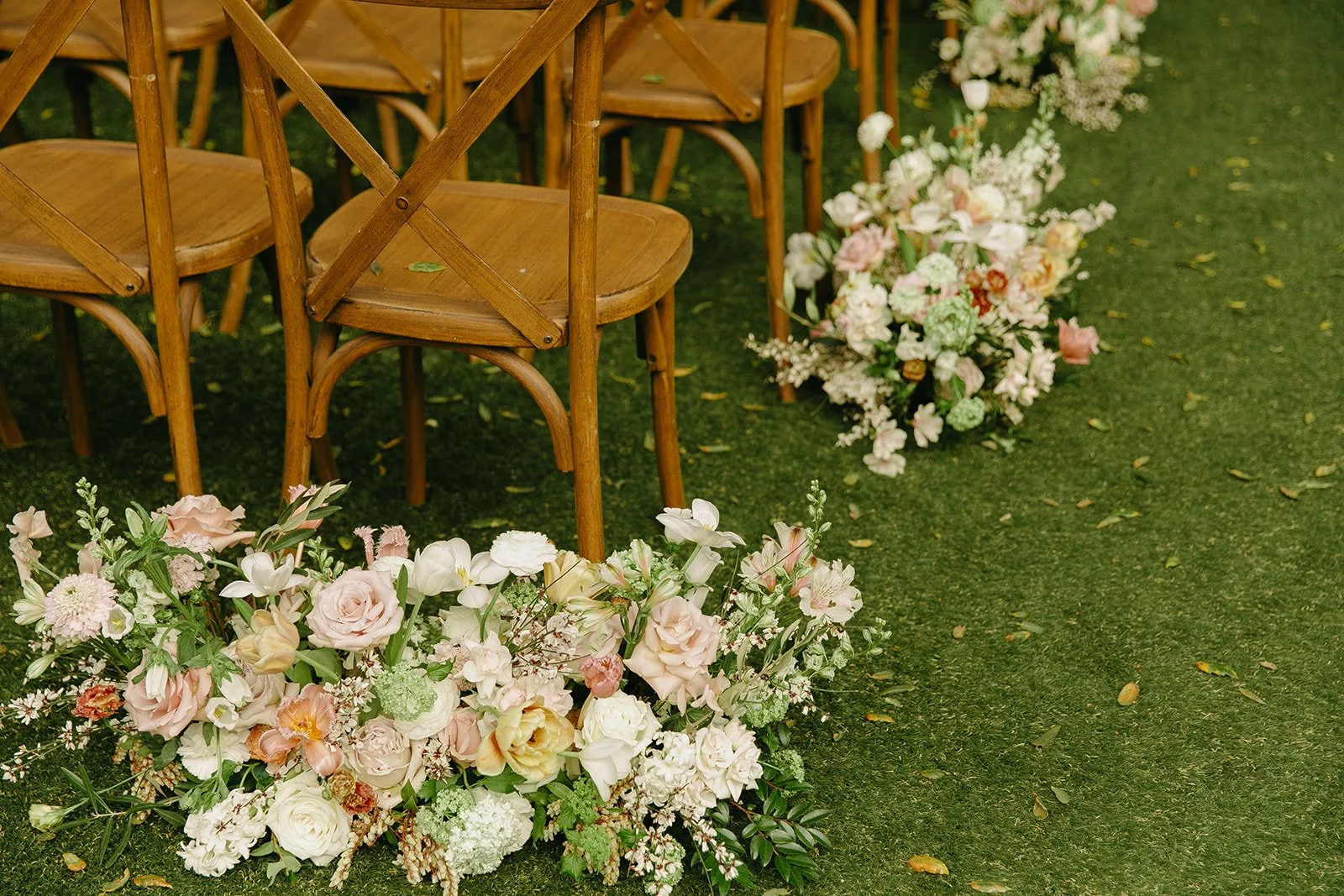 A wedding ceremony setup with wedding ceremony flowers