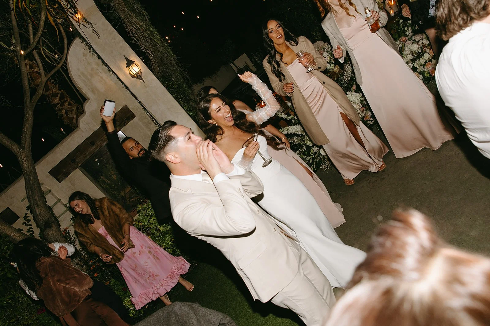 A bride and groom on the dance floor at a wedding reception
